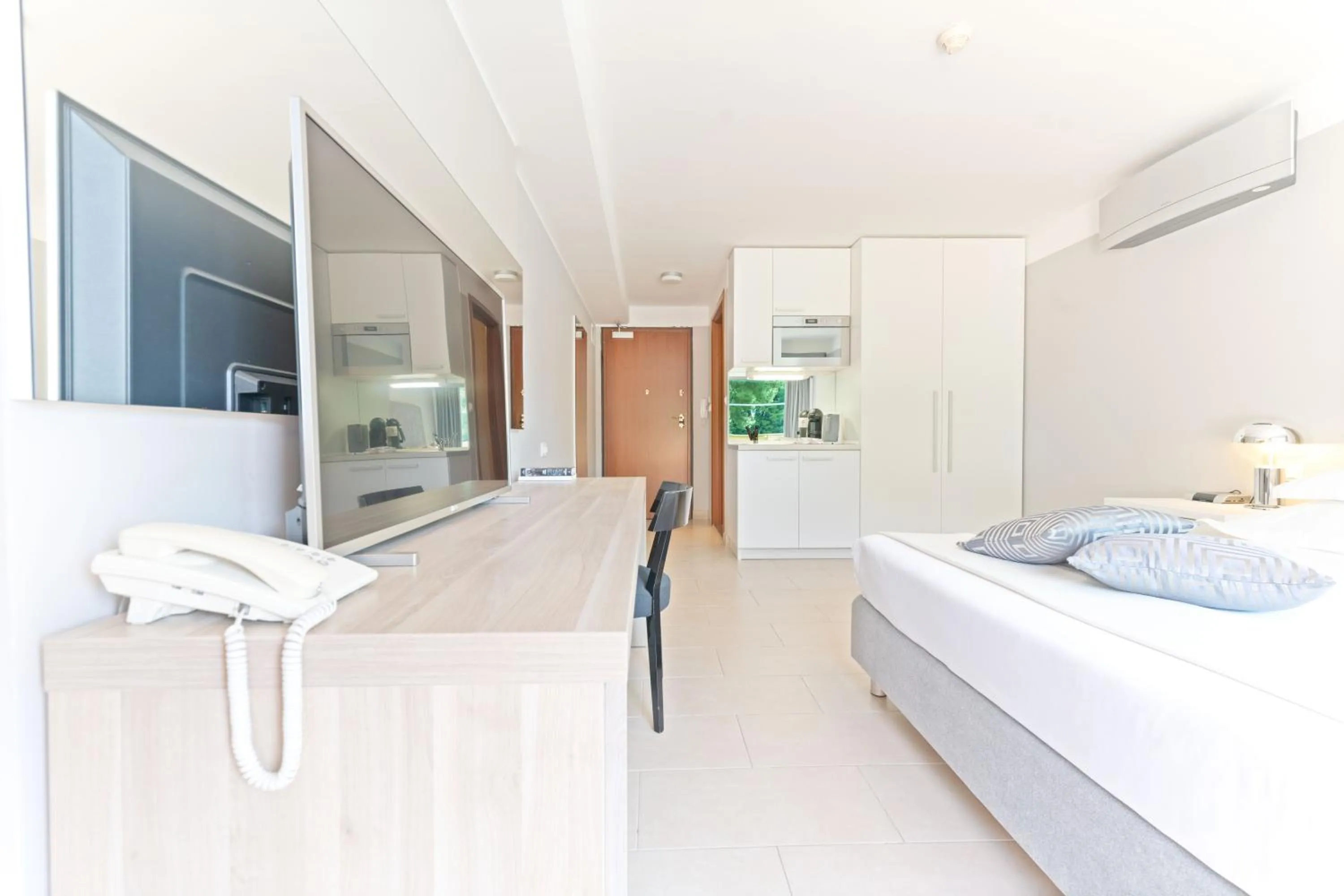 Bed in The Residence Aparthotel