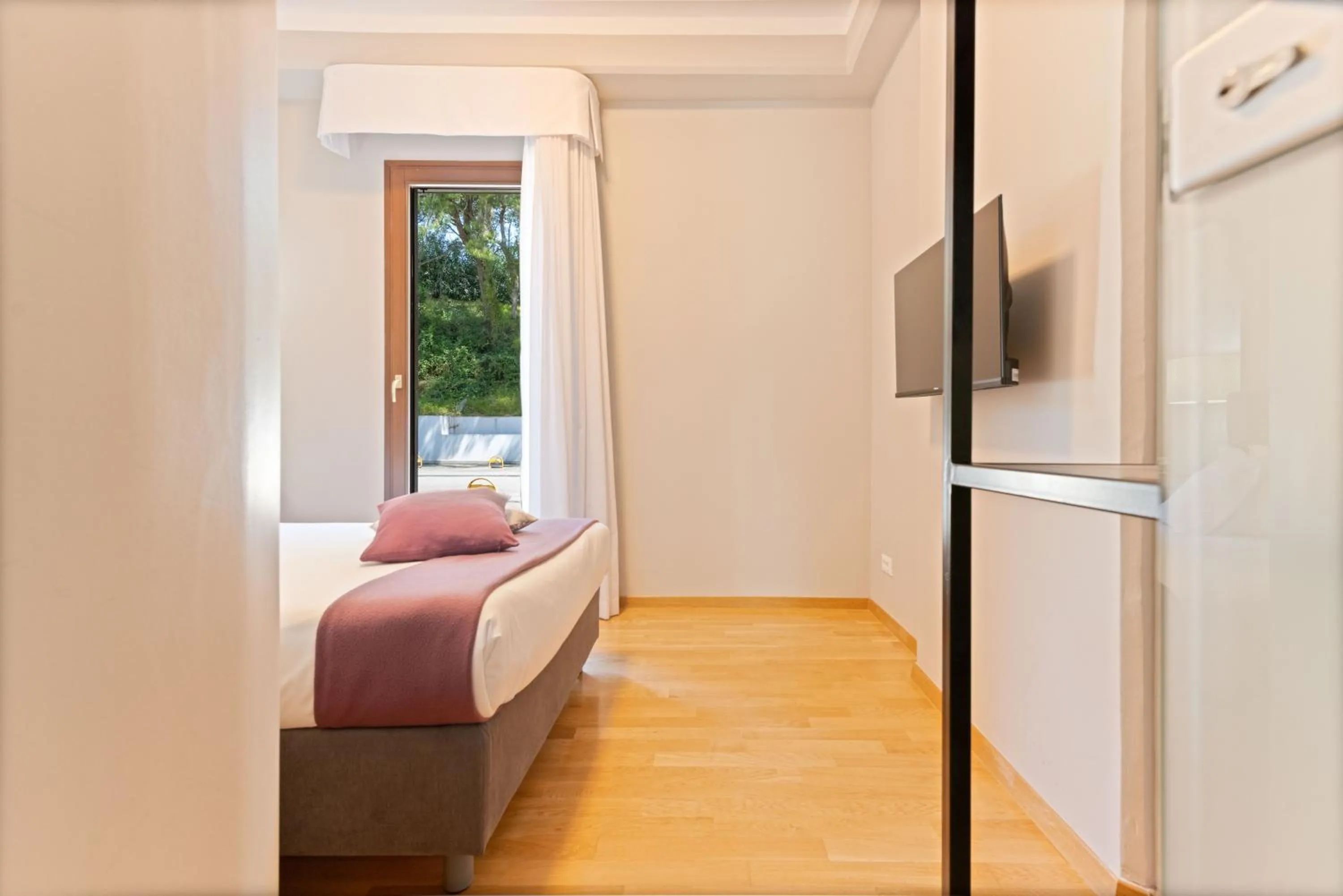 Bed in The Residence Aparthotel