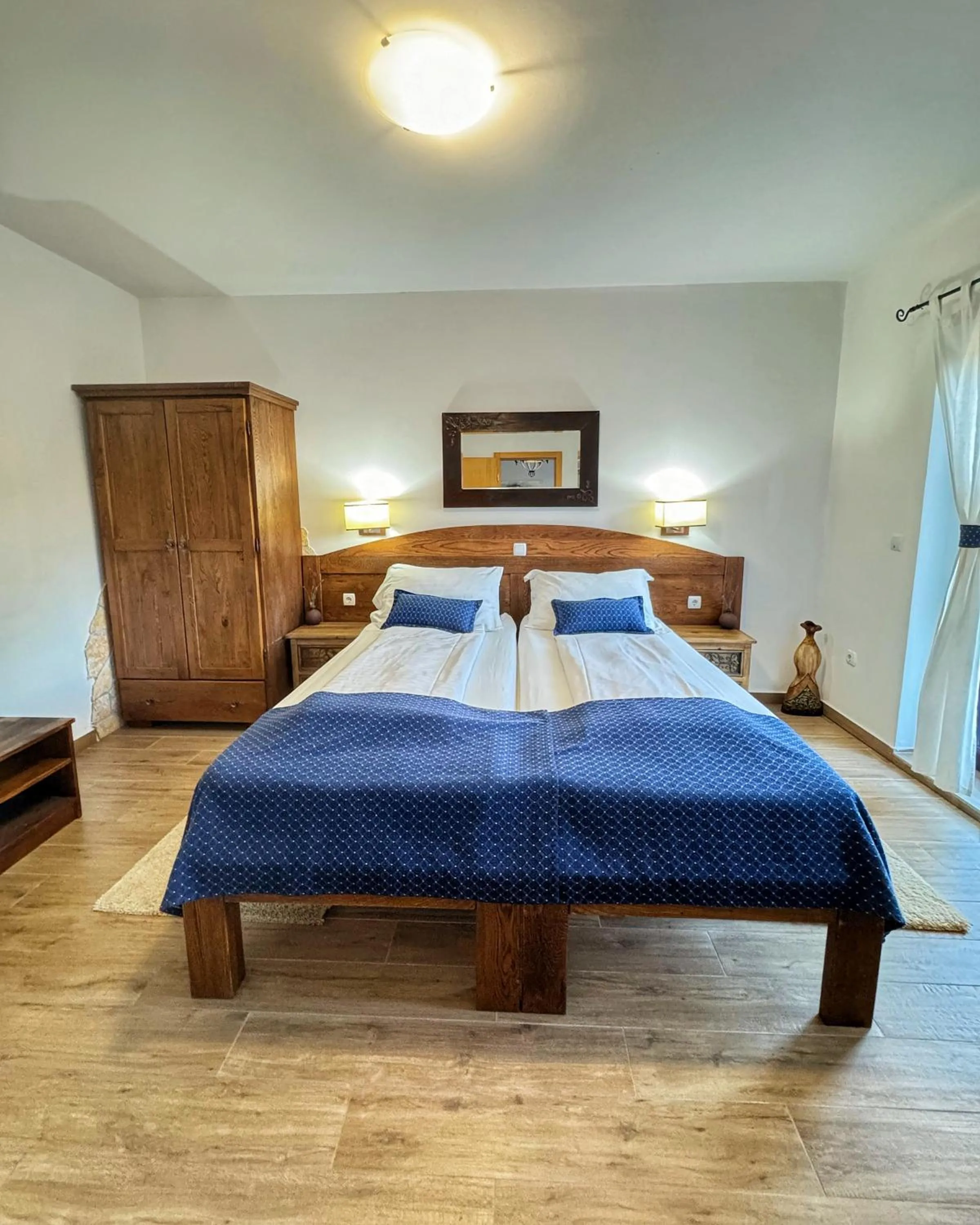 Bed in Etno Garden Apartments