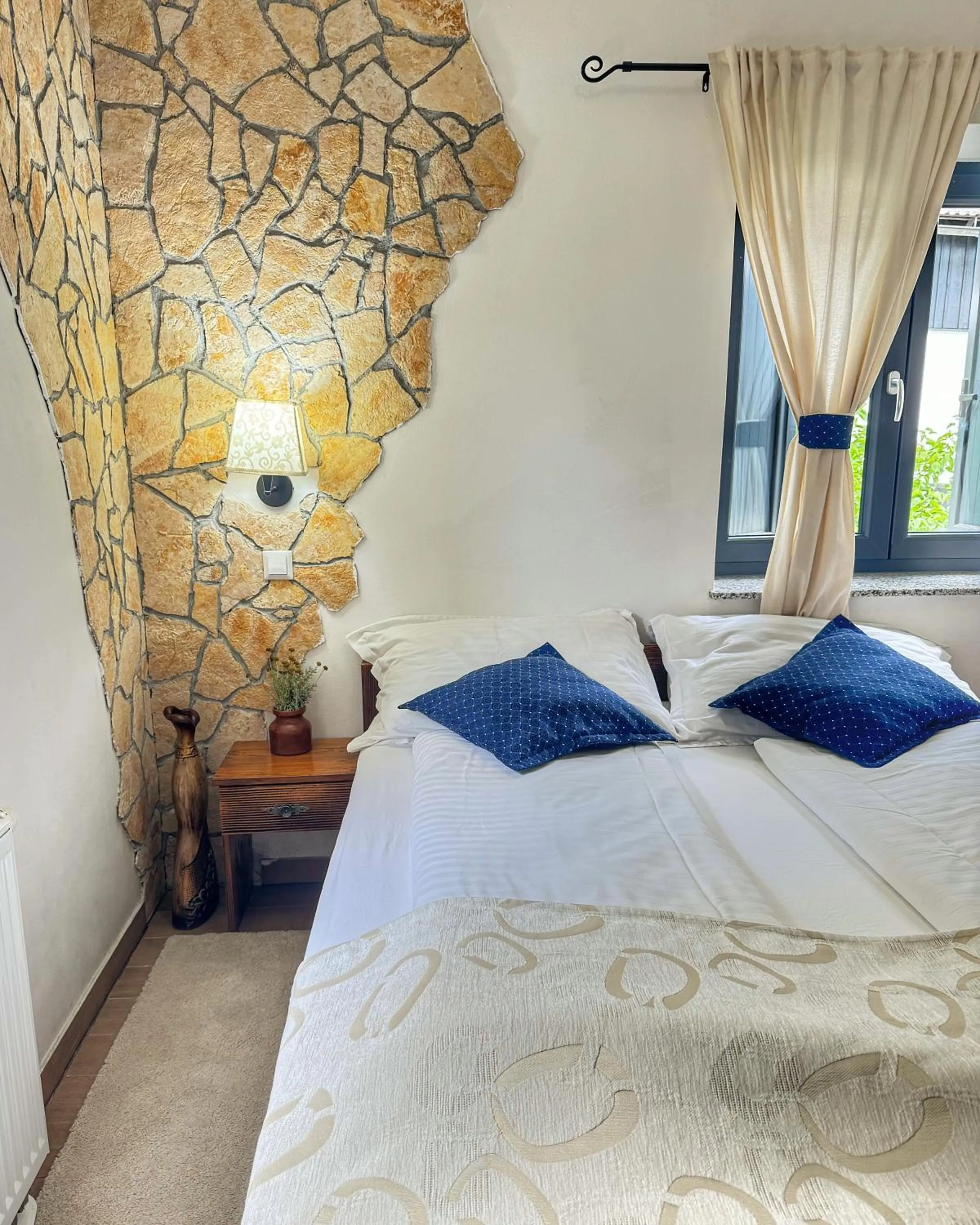 Bed in Etno Garden Apartments