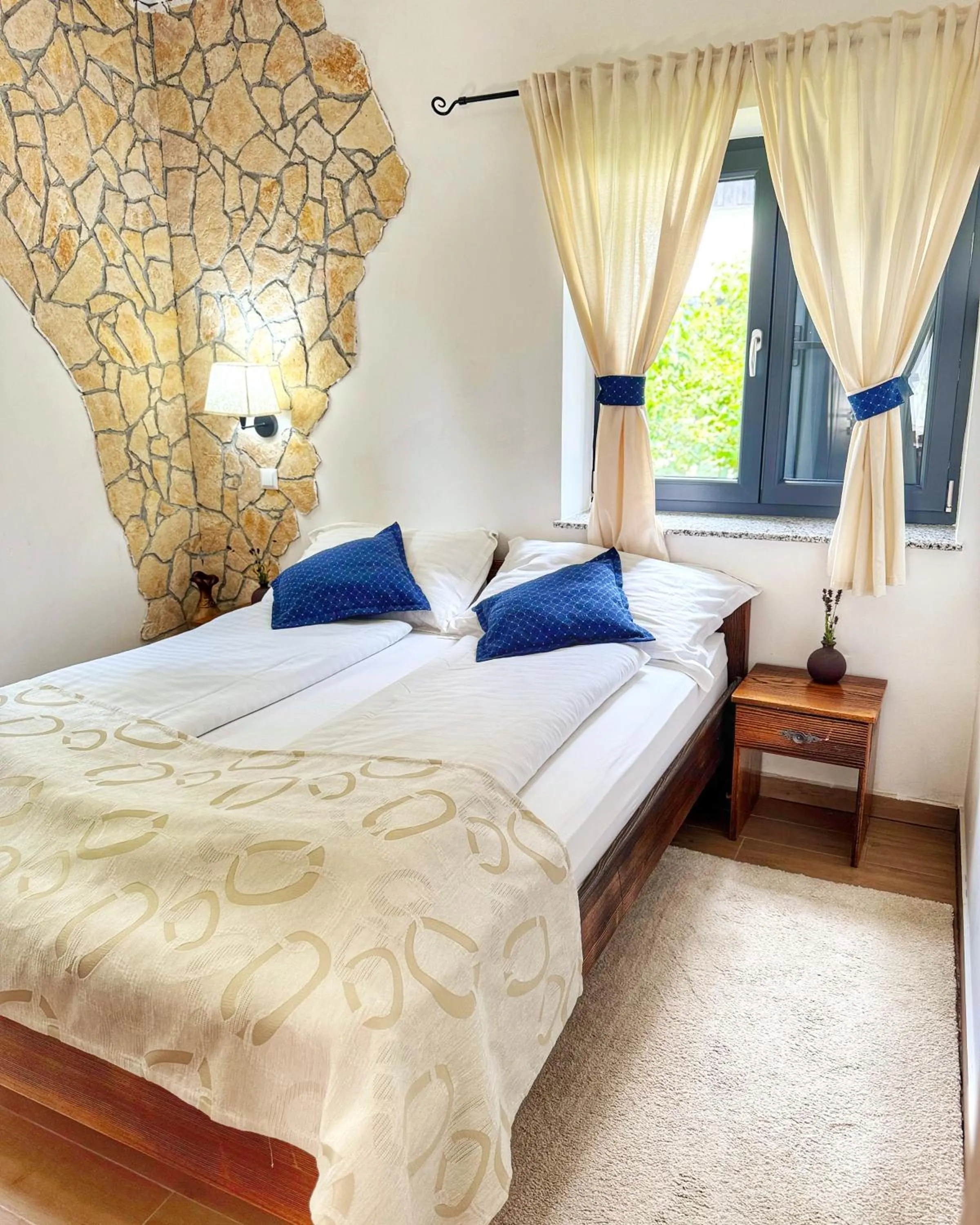 Bed in Etno Garden Apartments