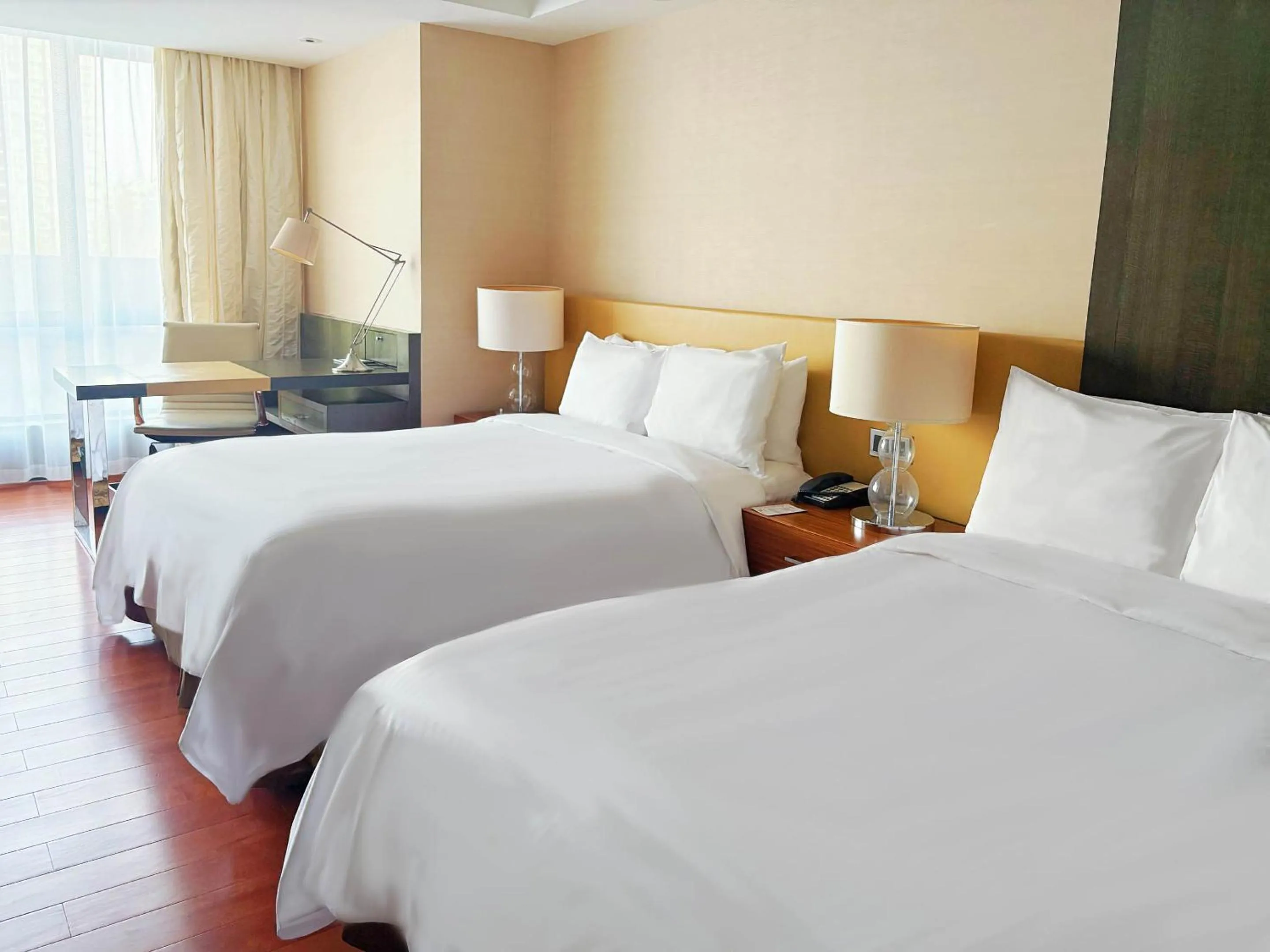 Bed in The Sandalwood Beijing Marriott Executive Apartments