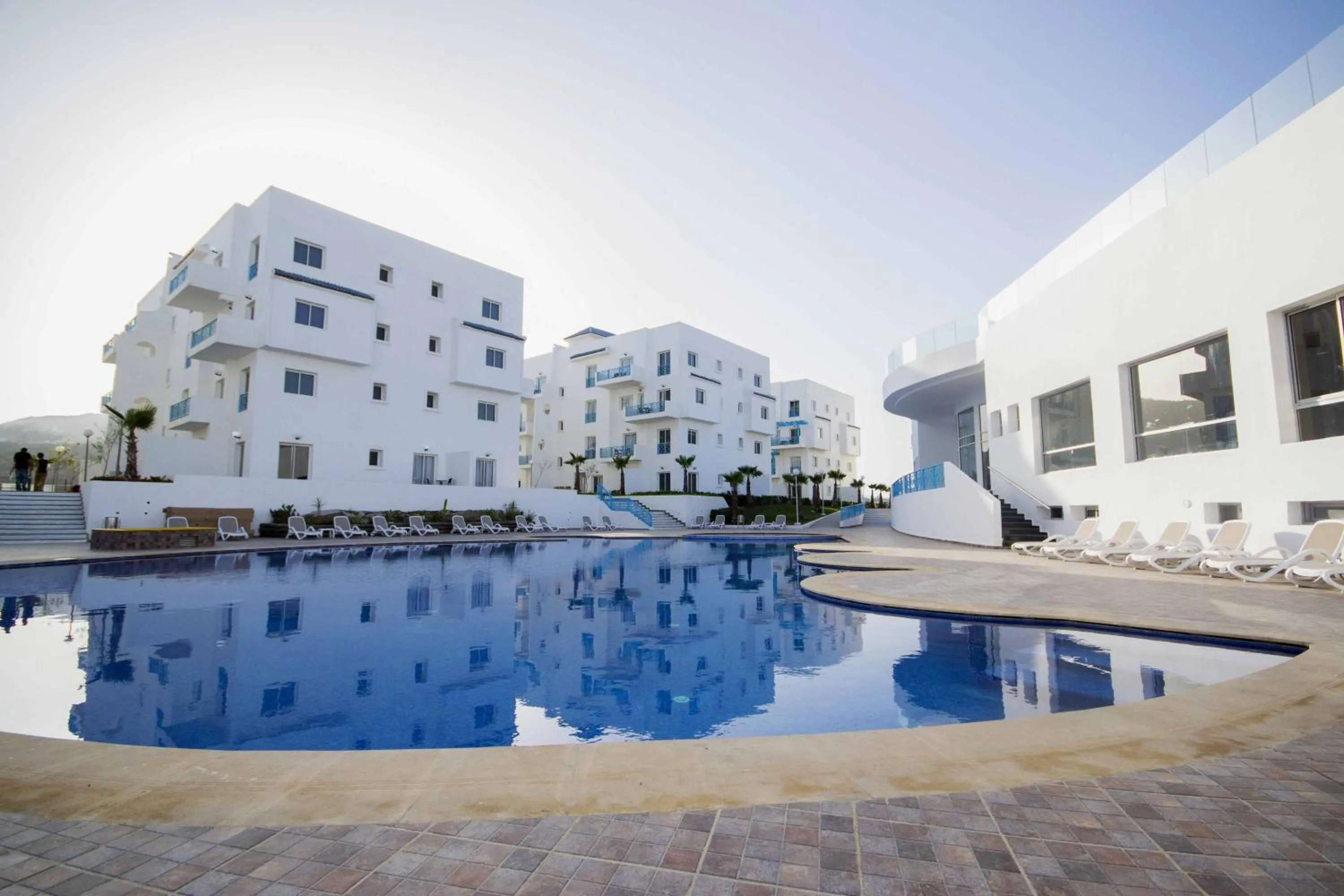 Swimming pool in L'escale Appart-hôtel By 7AV HOTELS