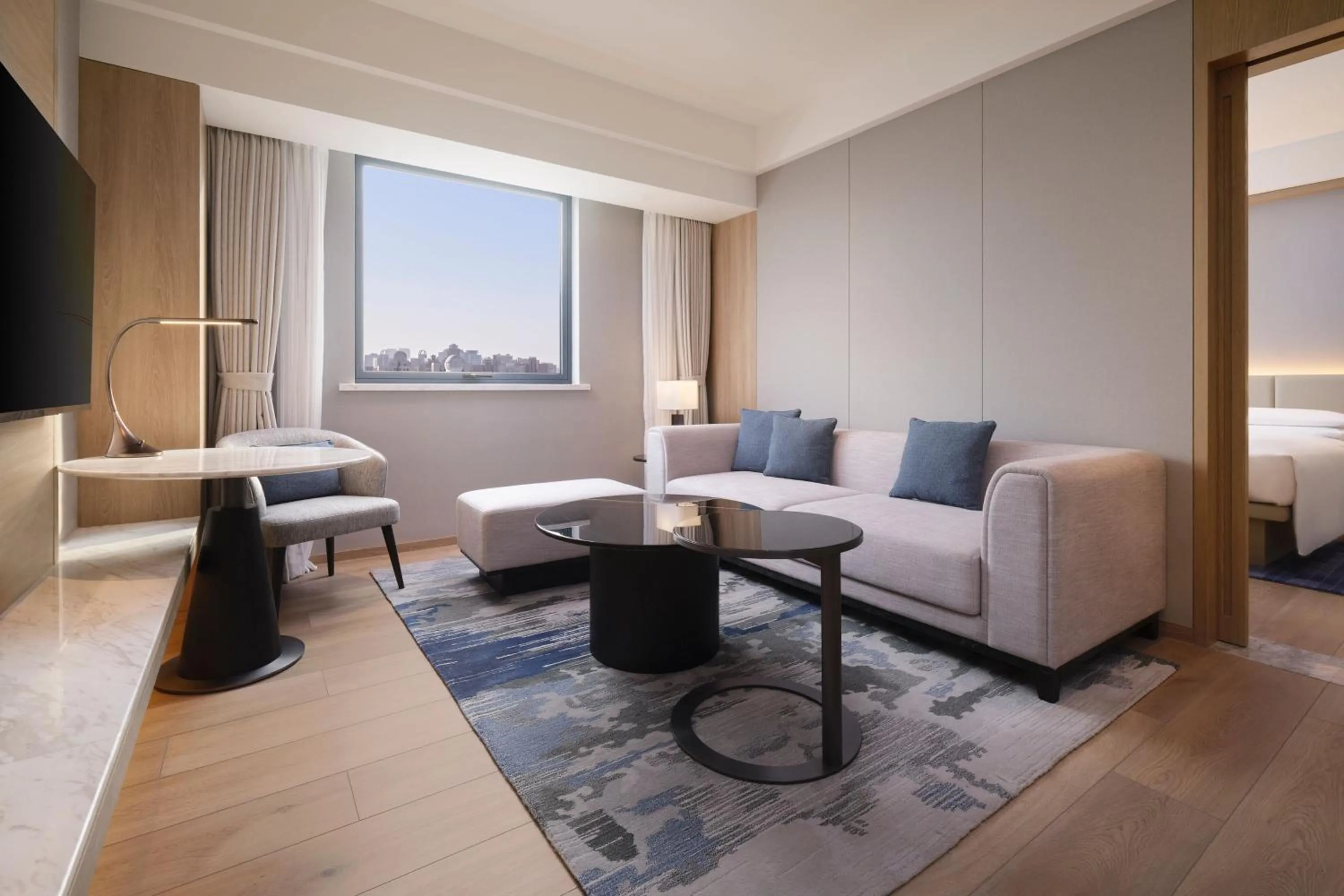 Living room, Bed in Courtyard By Marriott Shanghai Xujiahui