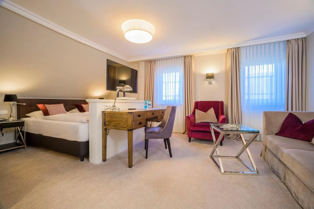 Seating area, Bed in Landhotel Donner