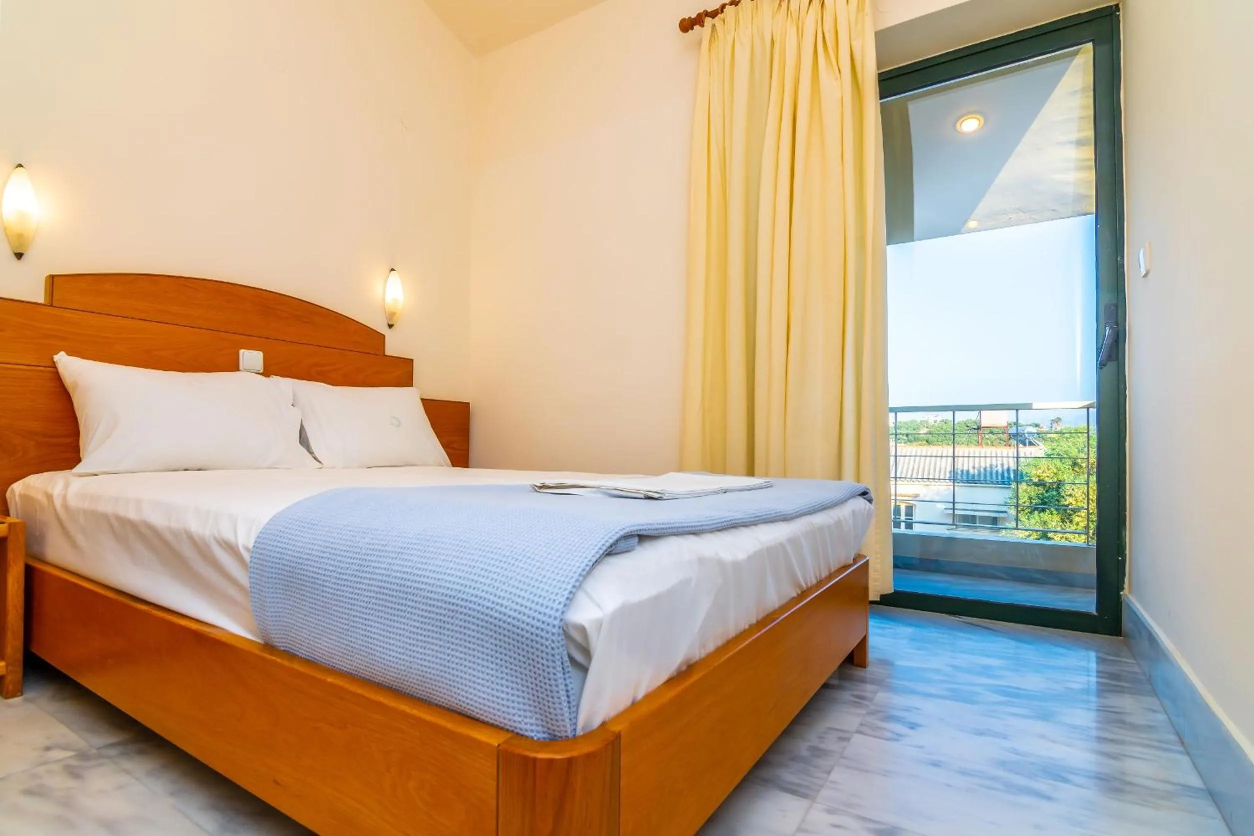 Bed in Orestis Hotel Sea View Apartments