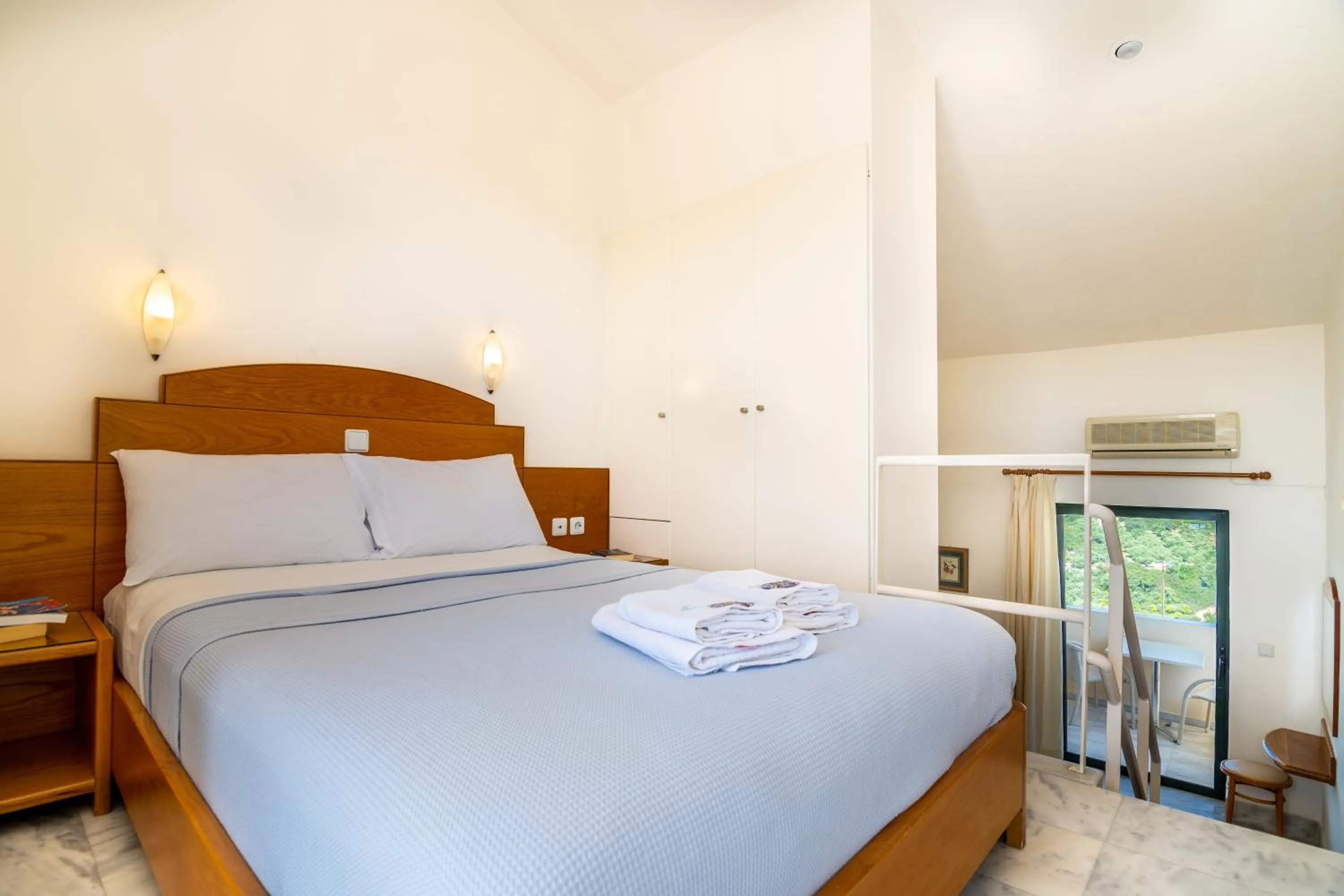 Bed in Orestis Hotel Sea View Apartments