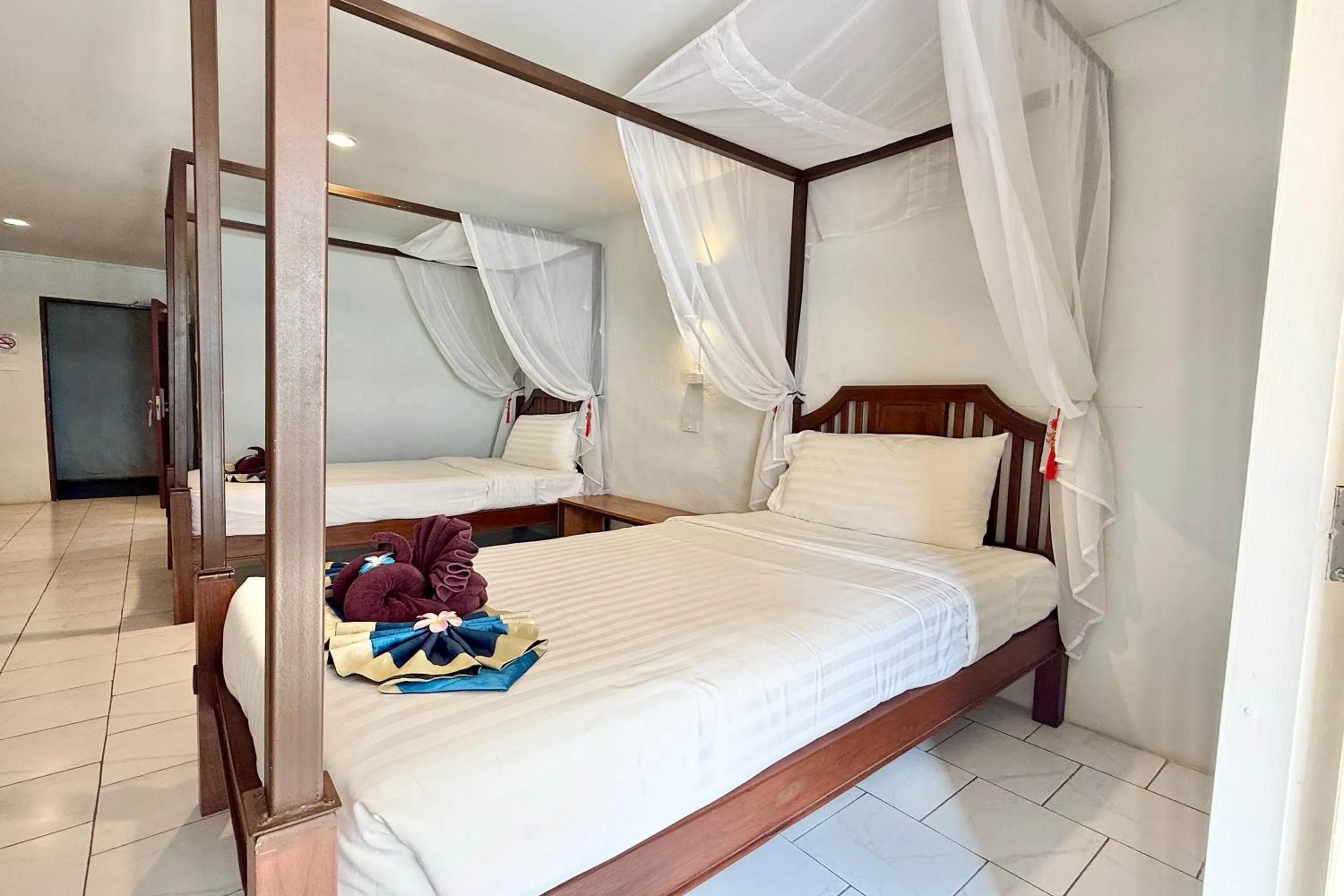 Bed in Sabaidee Chiangmai Hotel