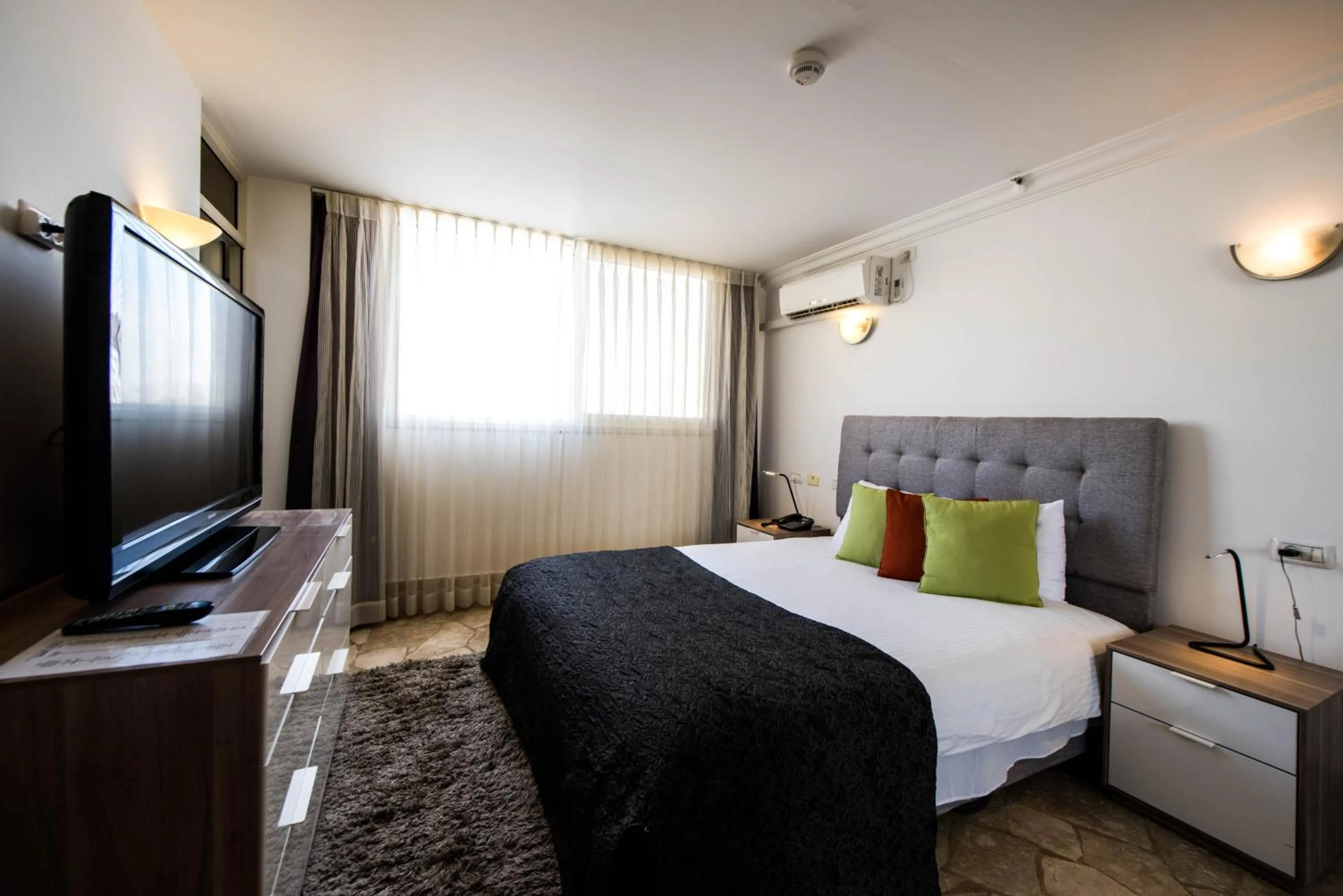 Bed in Ramon Suites by Smart Hotels