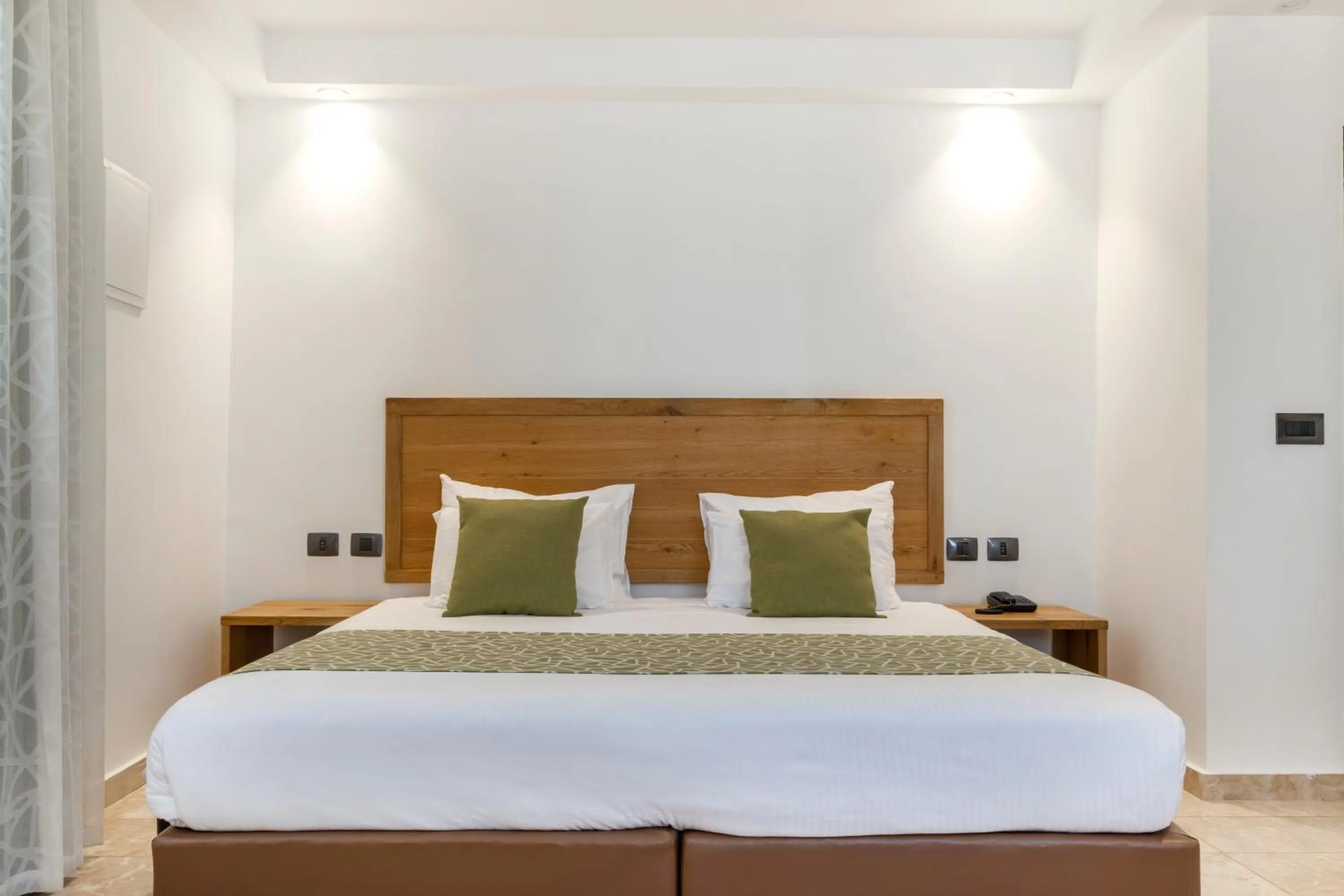 Bed in Ramon Suites by Smart Hotels