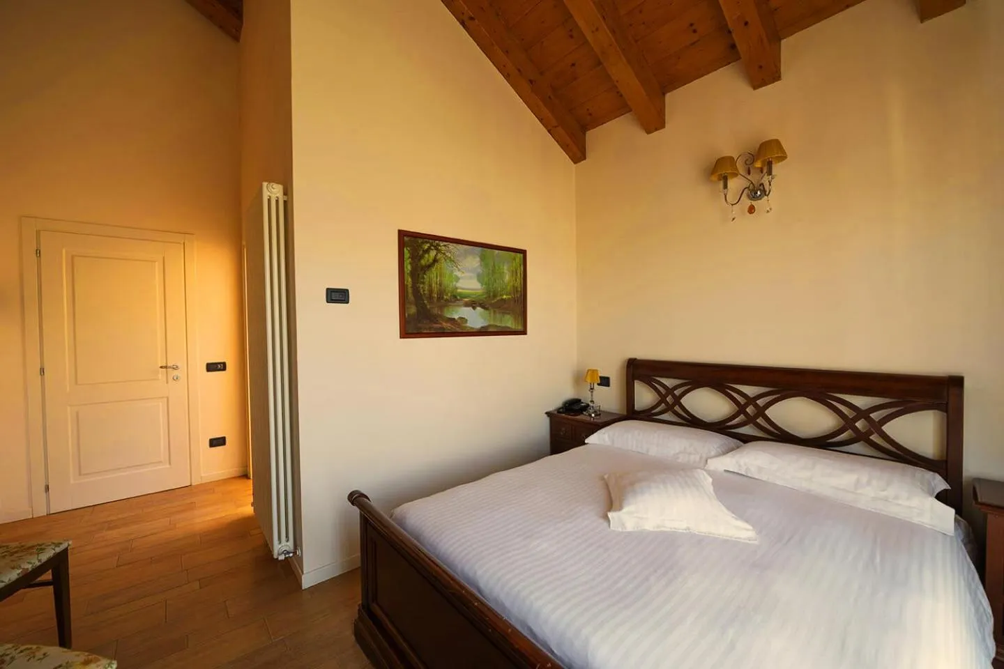 Bed in T'AMI Hotel Resort Spa