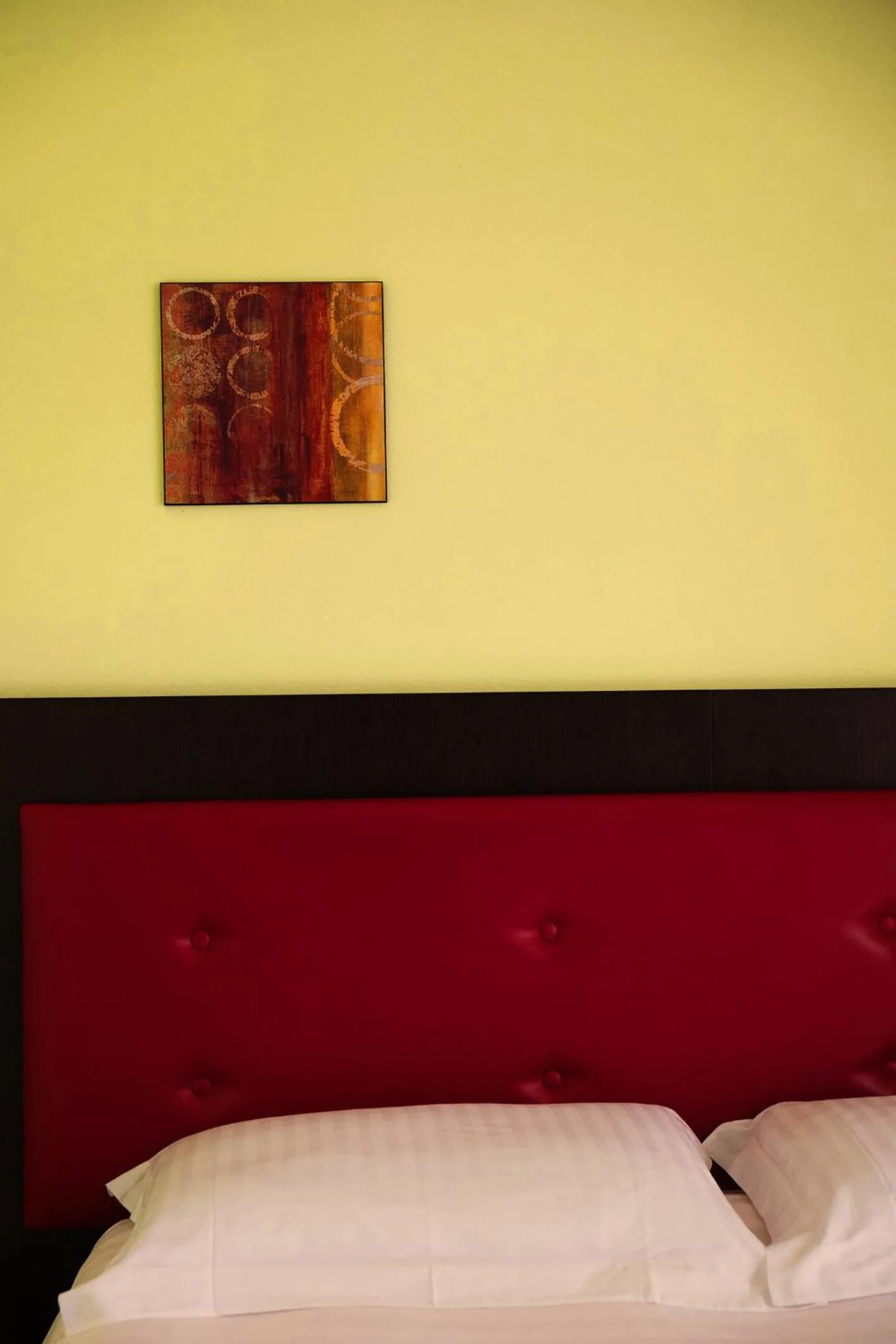 Bed in T'AMI Hotel Resort Spa