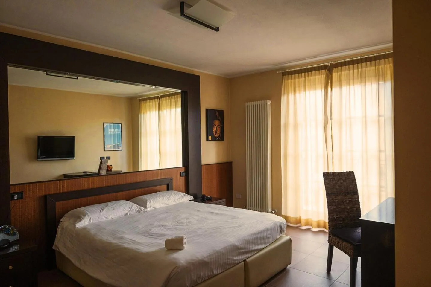 Bed in T'AMI Hotel Resort Spa