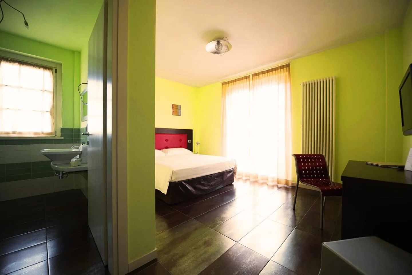 Bed in T'AMI Hotel Resort Spa