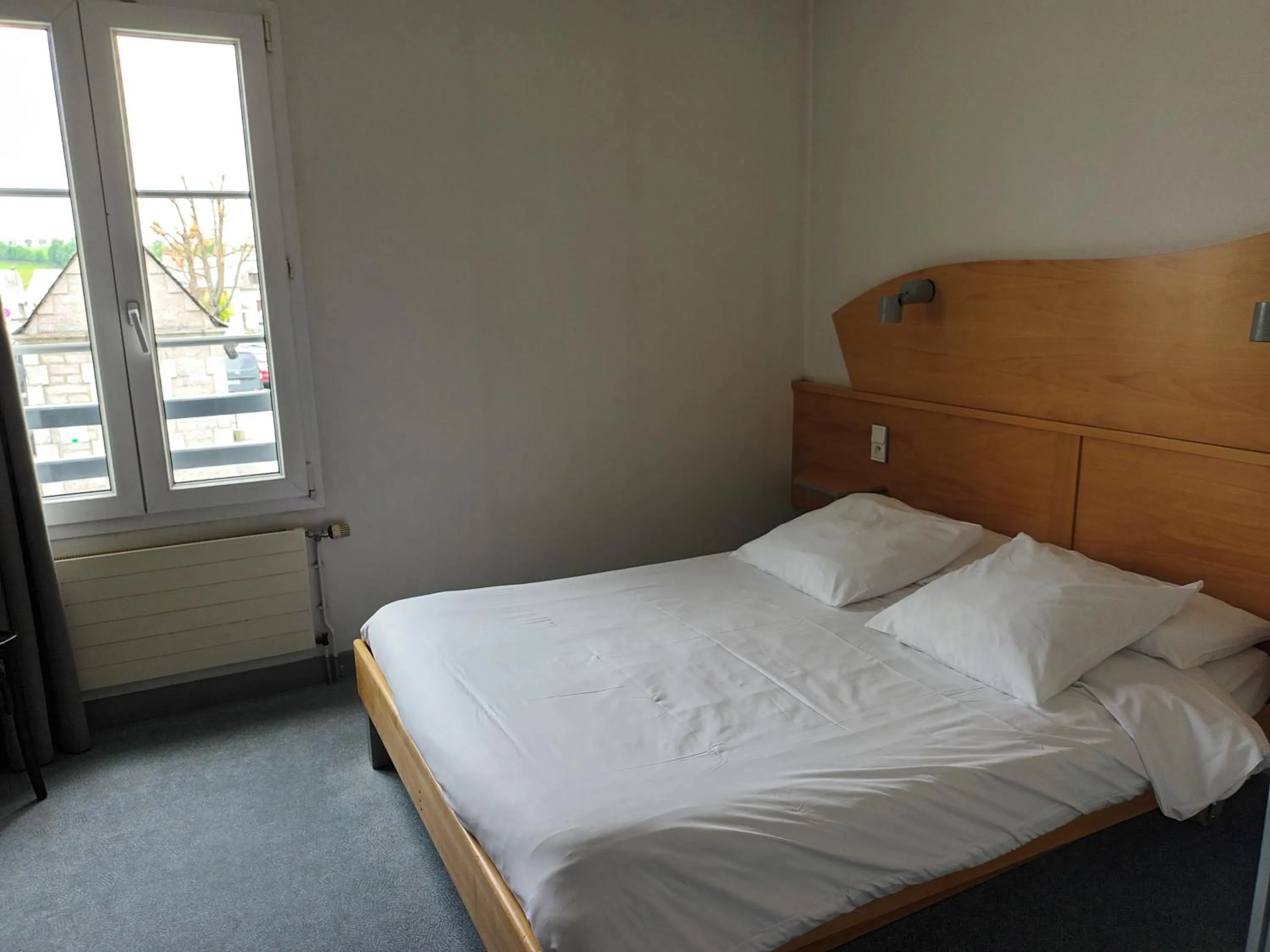 Photo of the whole room, Bed in Hôtel-Restaurant Logis l'Aubrac Laguiole