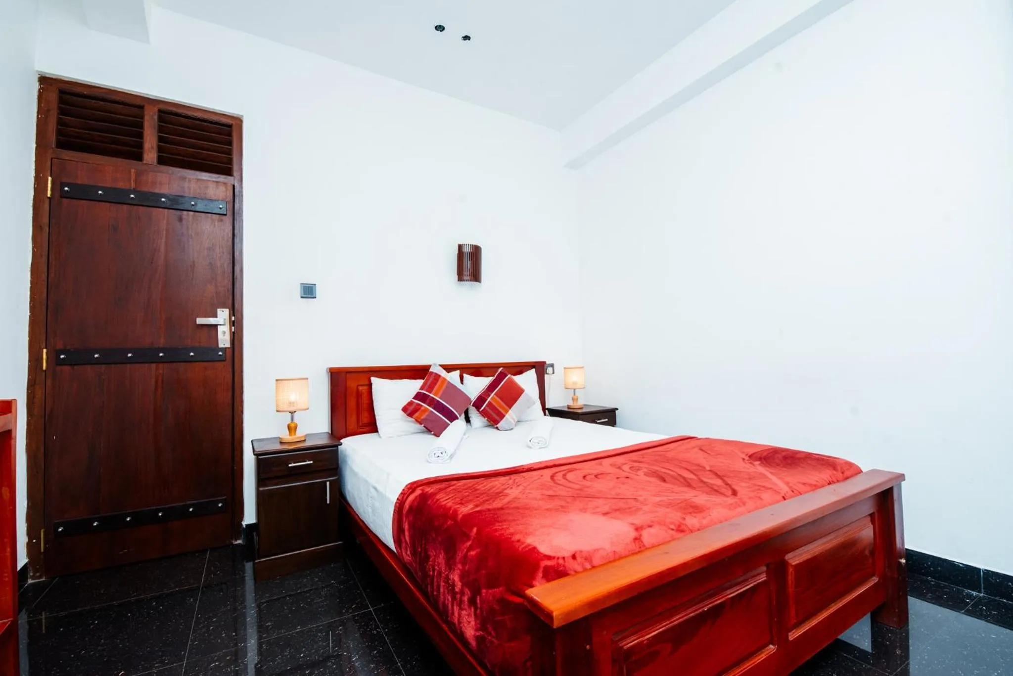 Bed in Adams Peak Inn