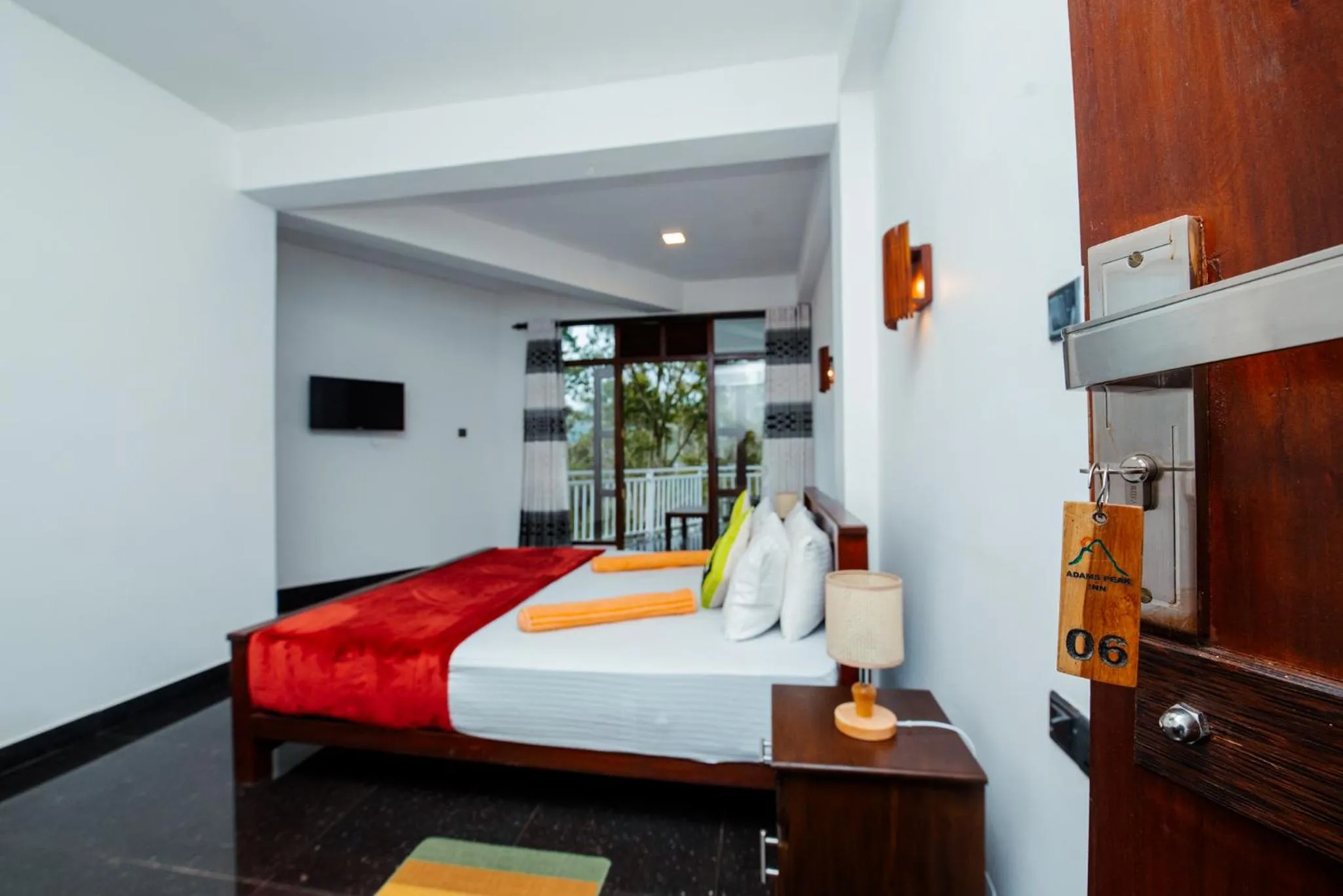 Bed in Adams Peak Inn