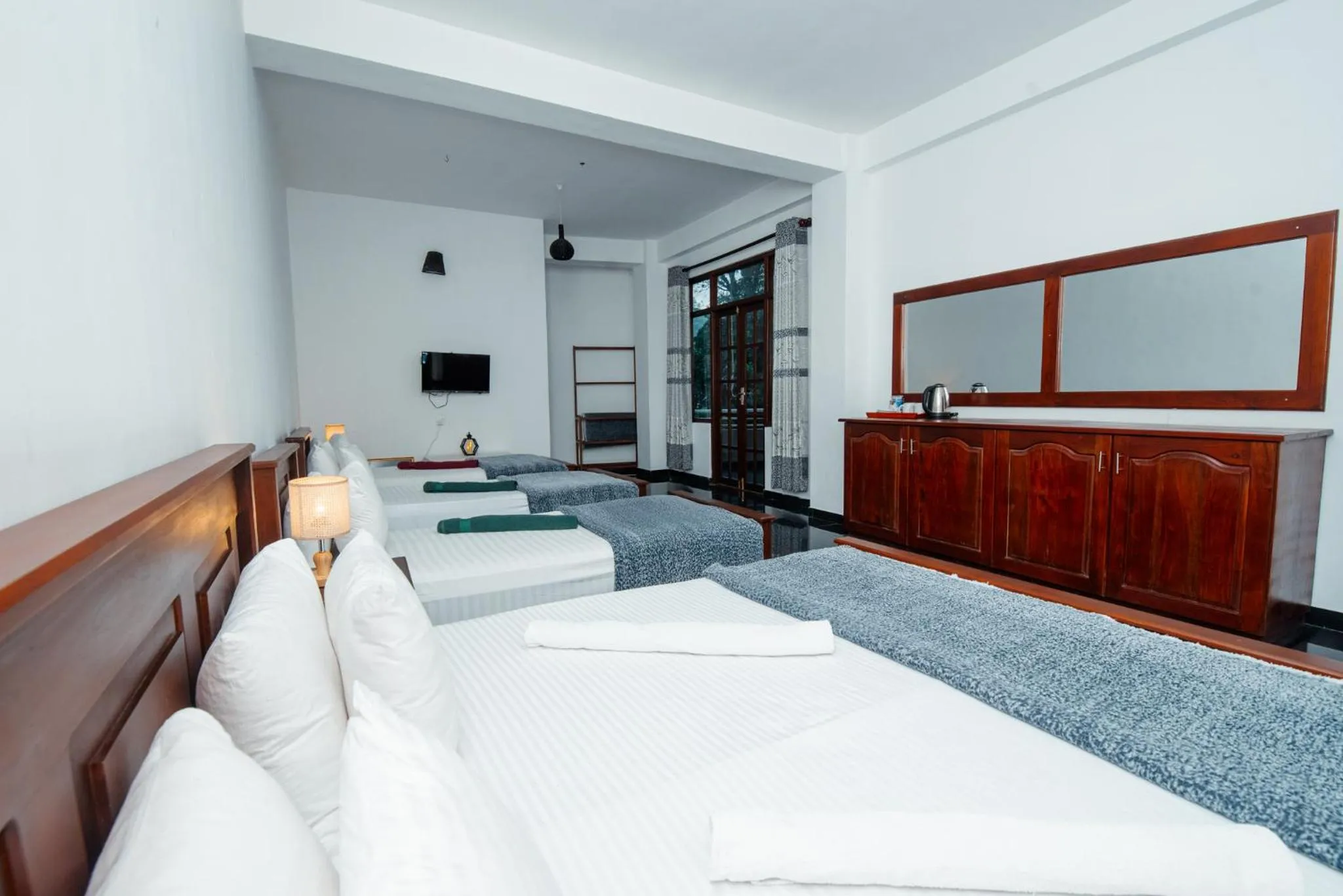 Bed in Adams Peak Inn