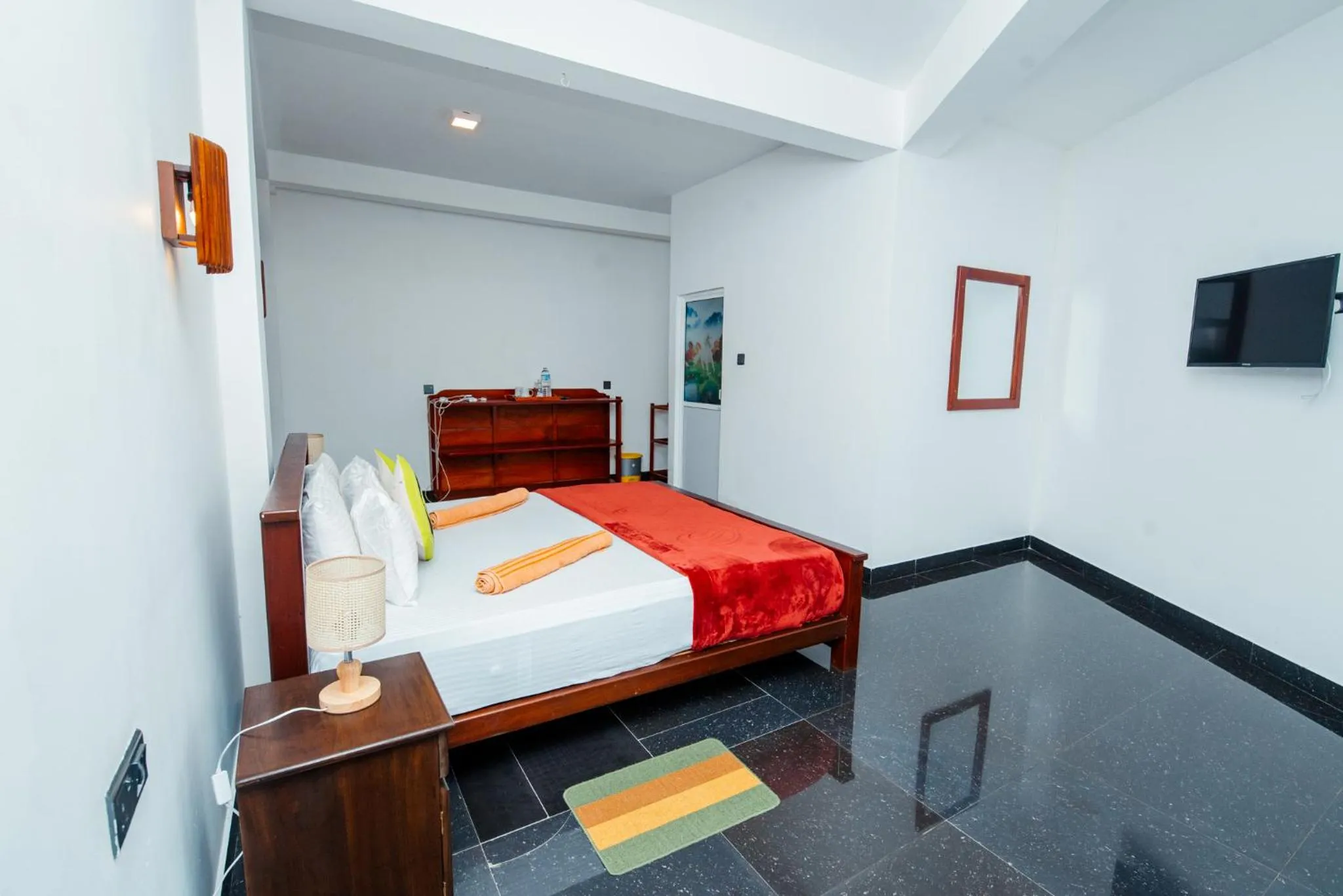 Bed in Adams Peak Inn