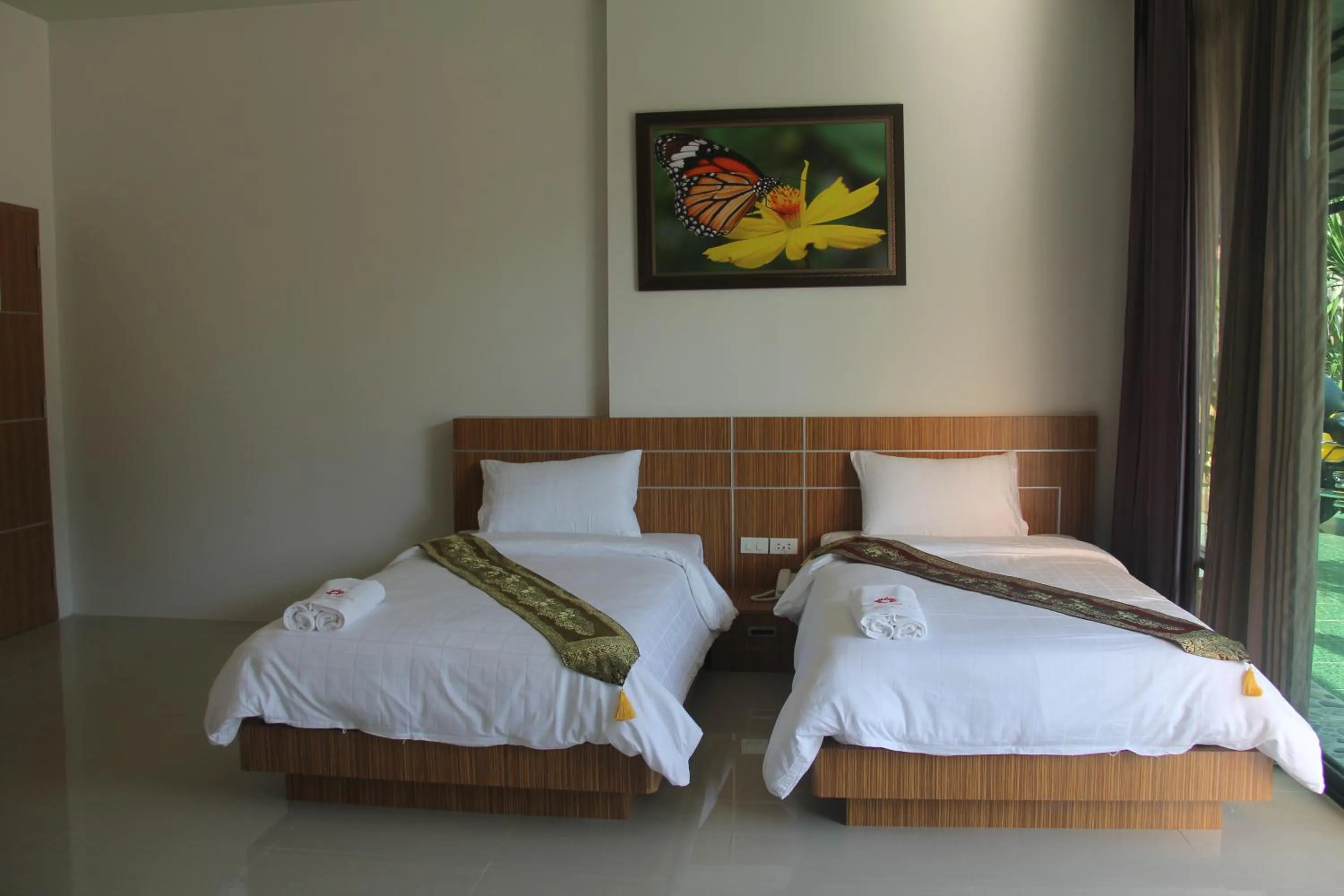 Bed in Tawan Anda Garden Hotel