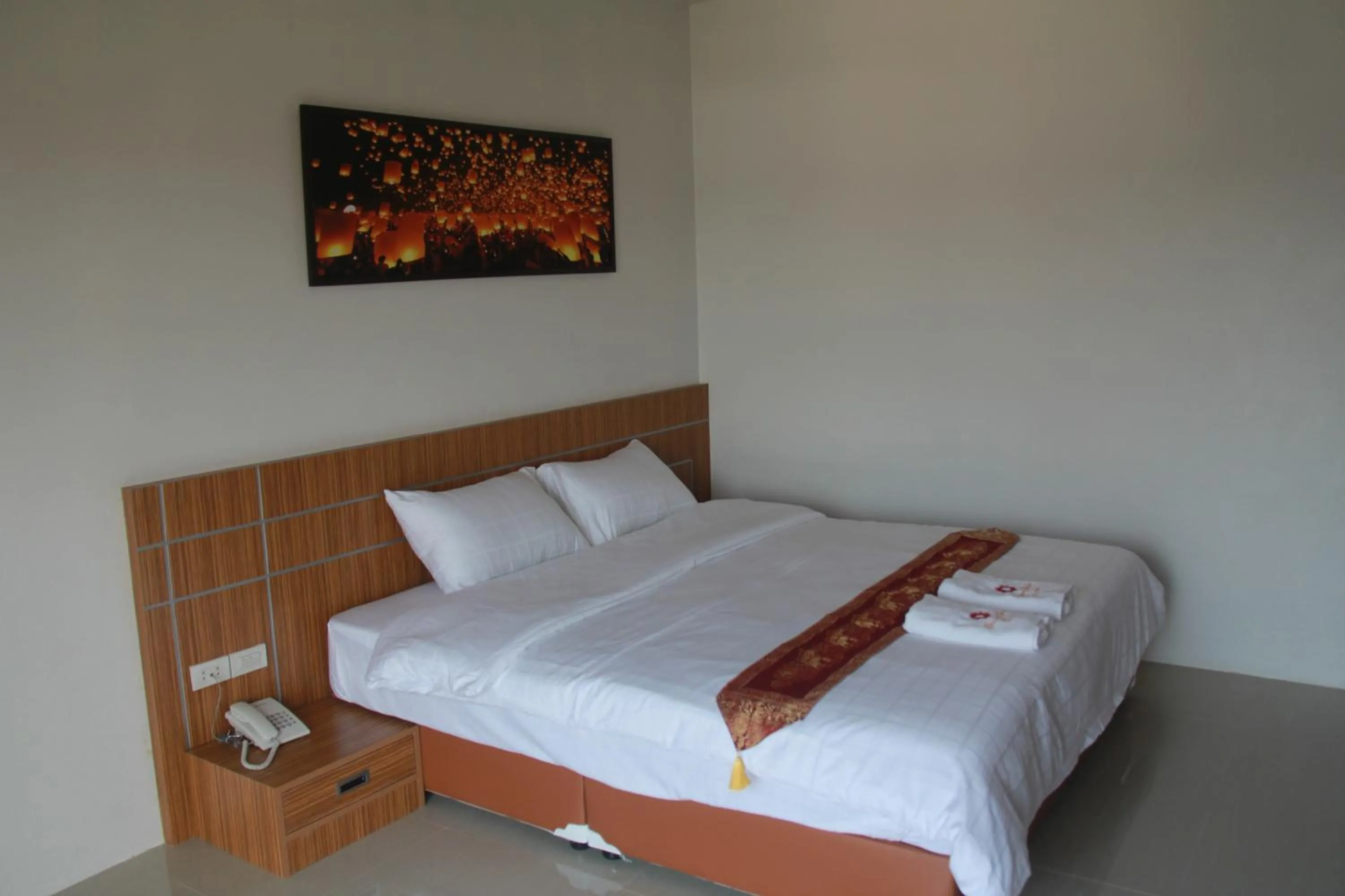 Bed in Tawan Anda Garden Hotel