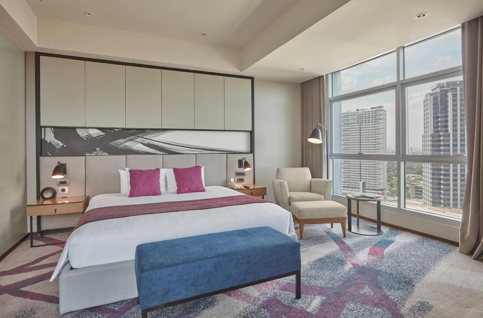 Photo of the whole room, Bed in Crowne Plaza Manila Galleria by IHG