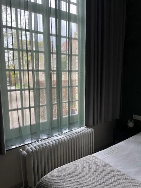 Bed in Amaryllis Hotel Veurne