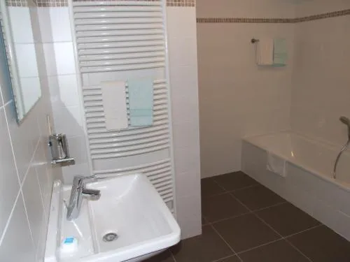 Bathroom in Well'in Hotel