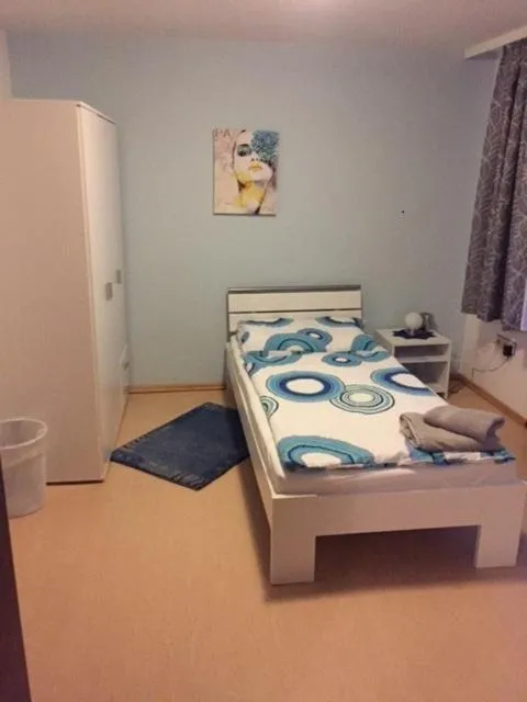 Bed in Haus Tina Zimmer