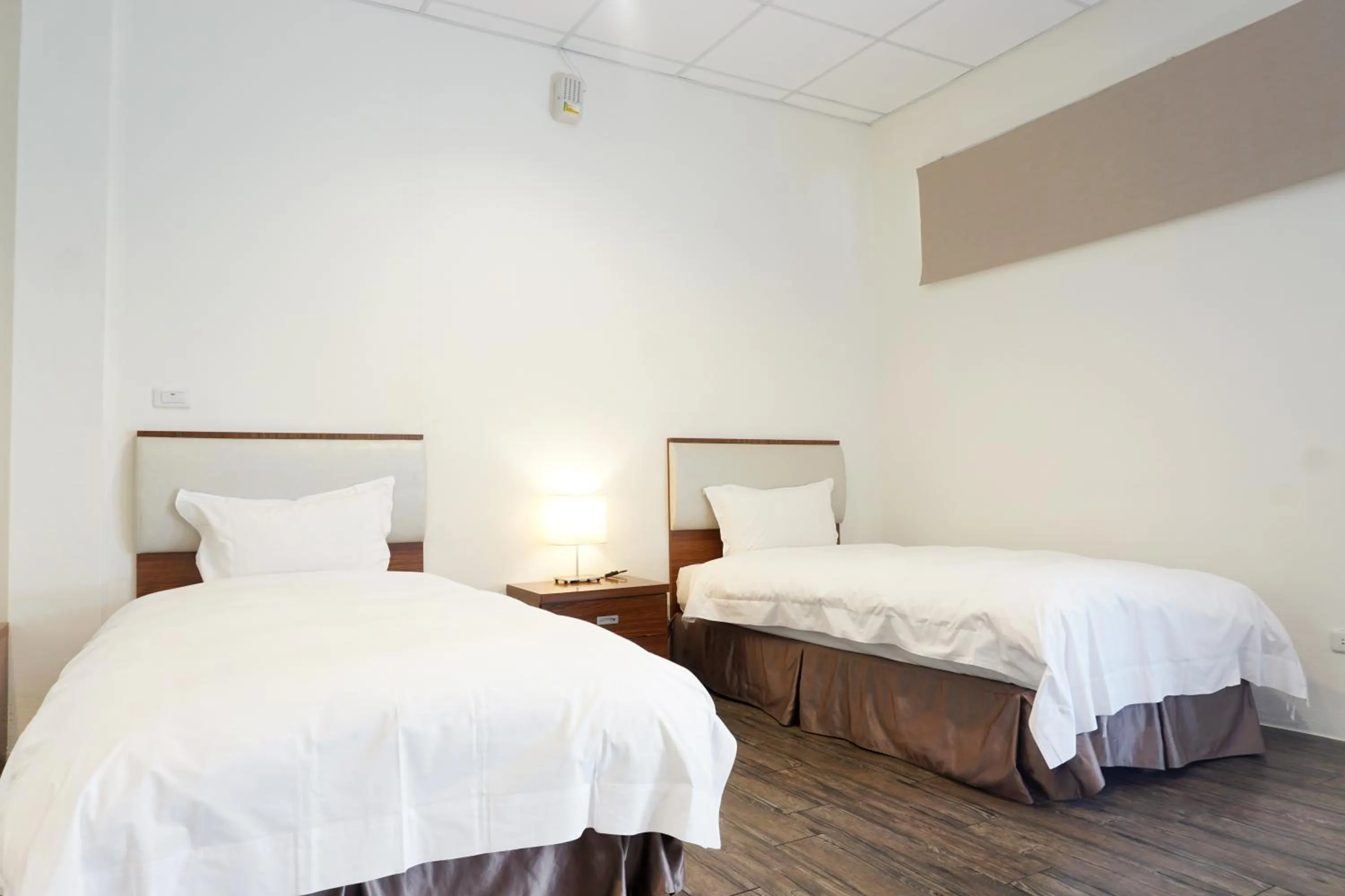 Bed in NCNU Campus Inn暨大行旅