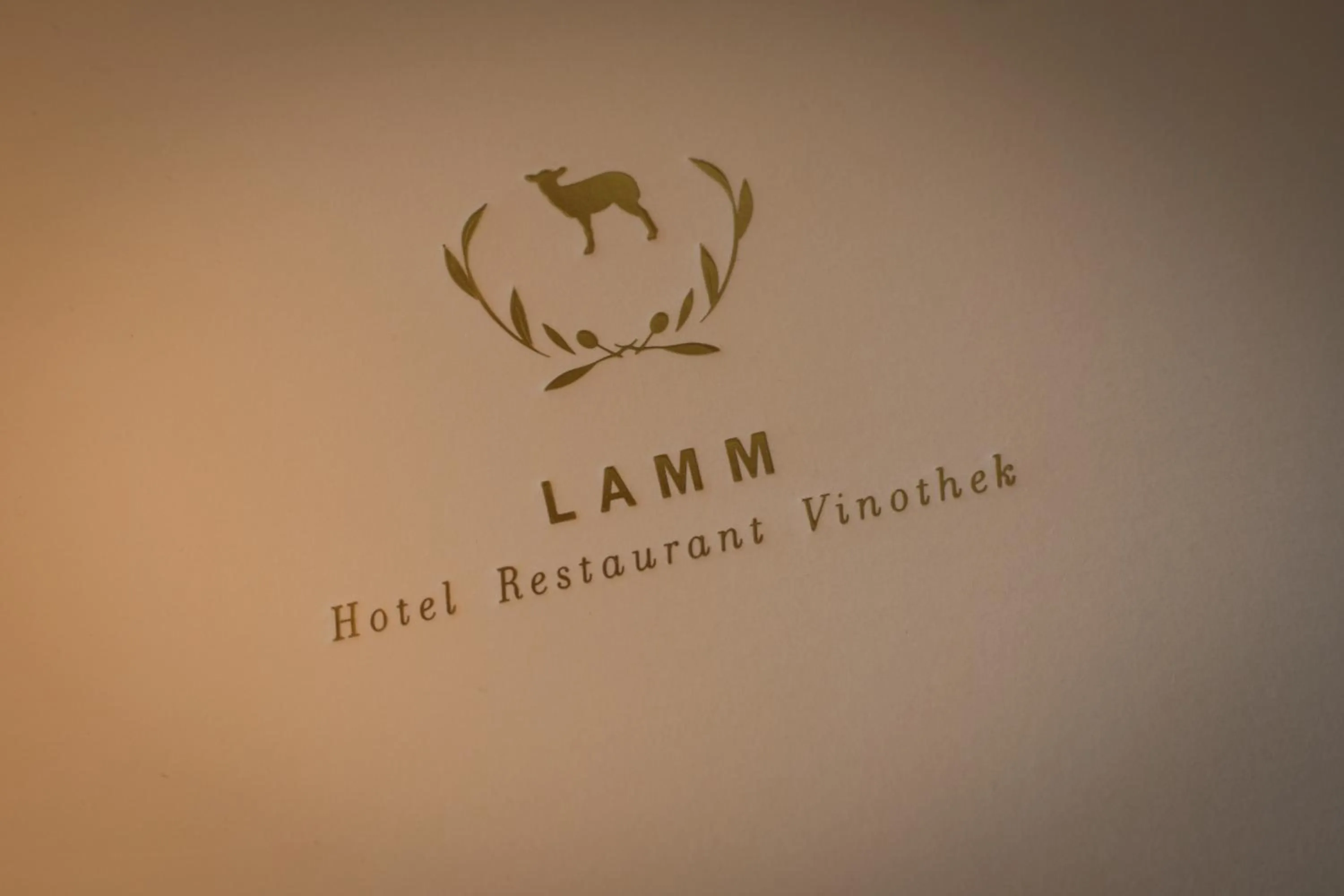 Property logo or sign in Hotel Restaurant Vinothek LAMM