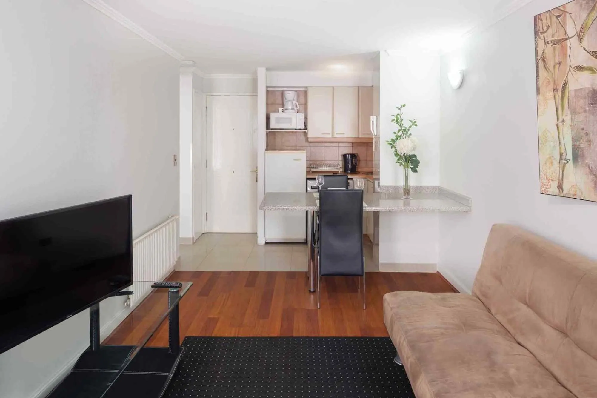 Communal lounge/ TV room in Santa Magdalena Apartments