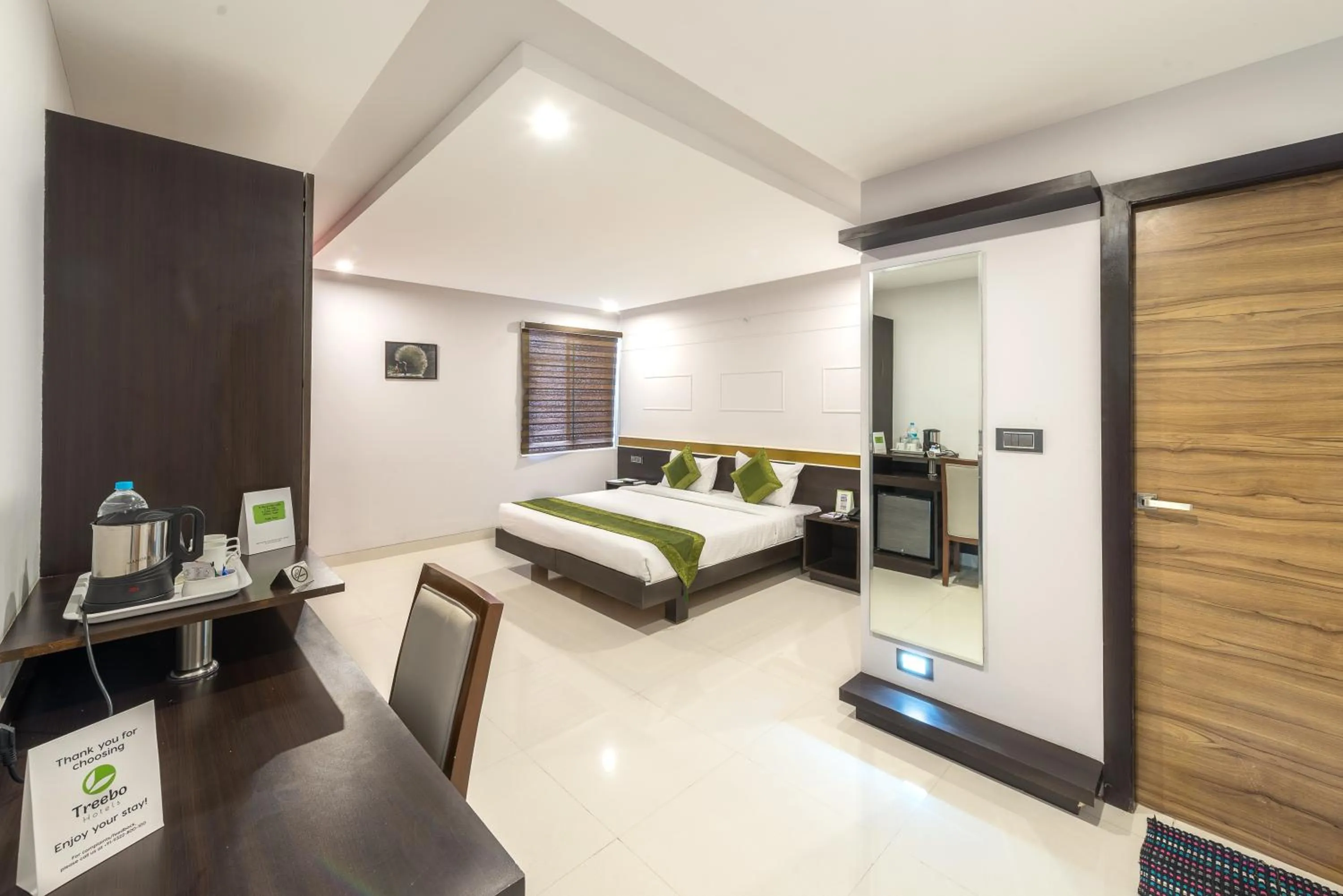 Bedroom, Bed in Treebo Raj Premier, Indiranagar