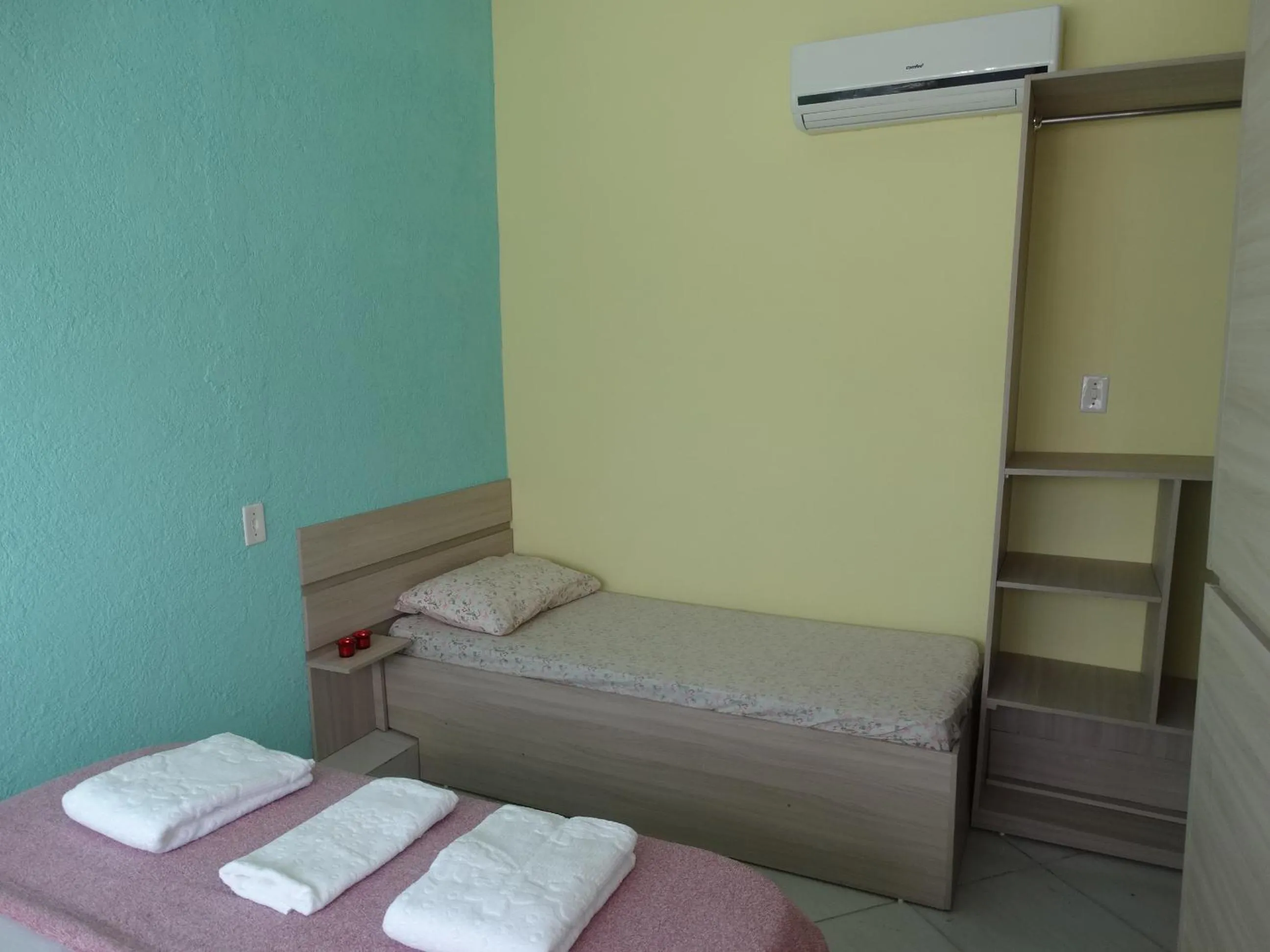 Bed in Pousada Oliveira