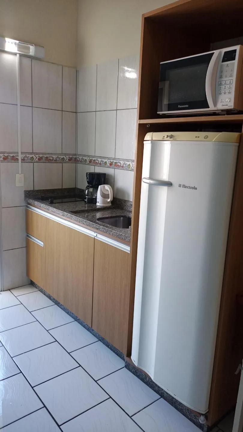 Kitchen or kitchenette in Pousada Oliveira