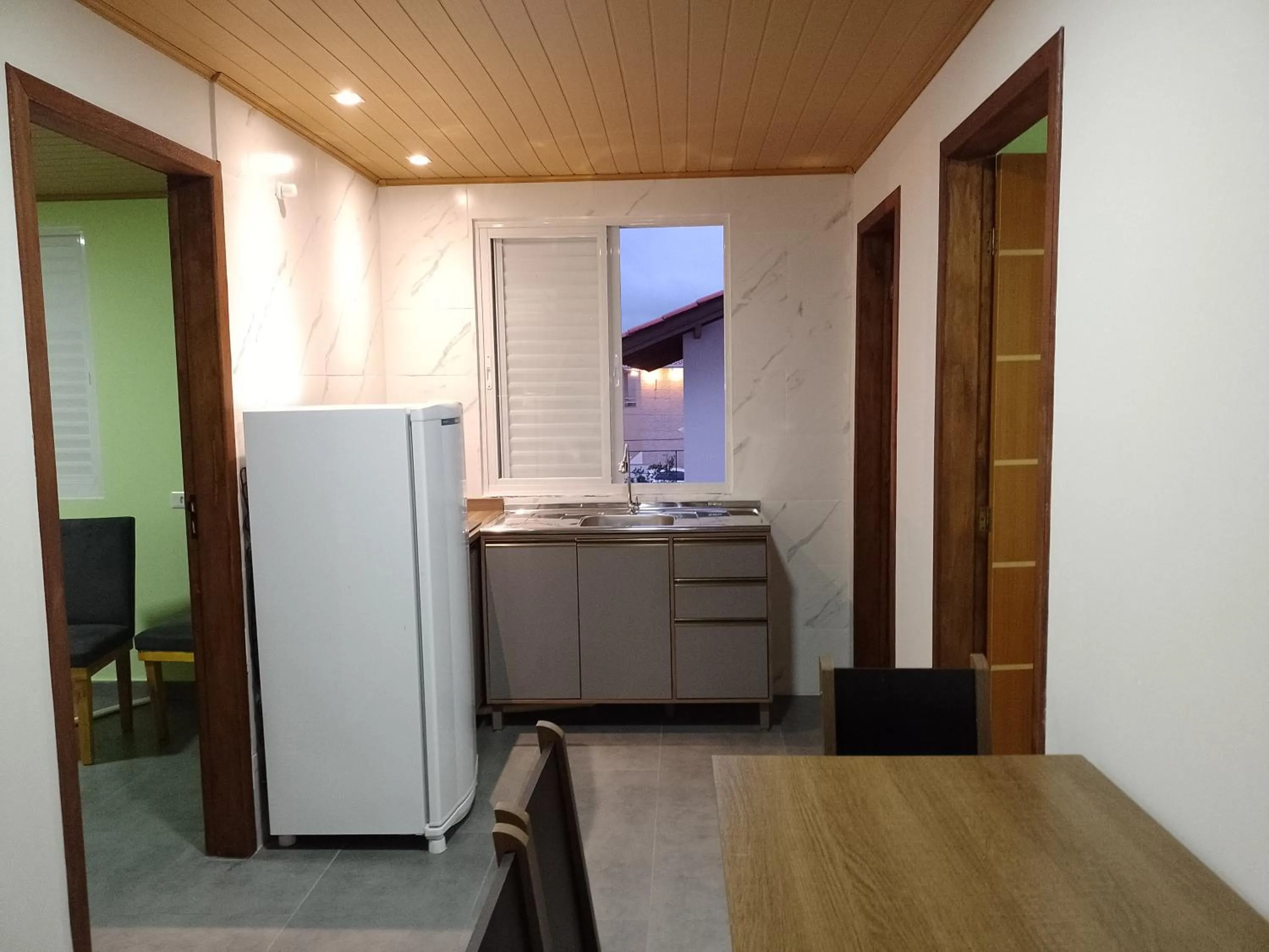 Kitchen or kitchenette in Pousada Oliveira