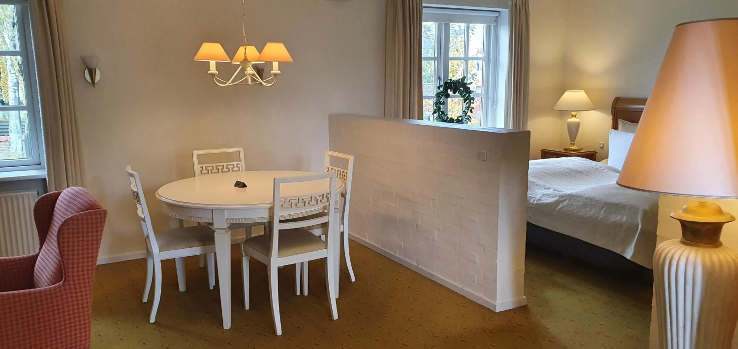 Seating area, Bed in Hotel Knudsens Gaard