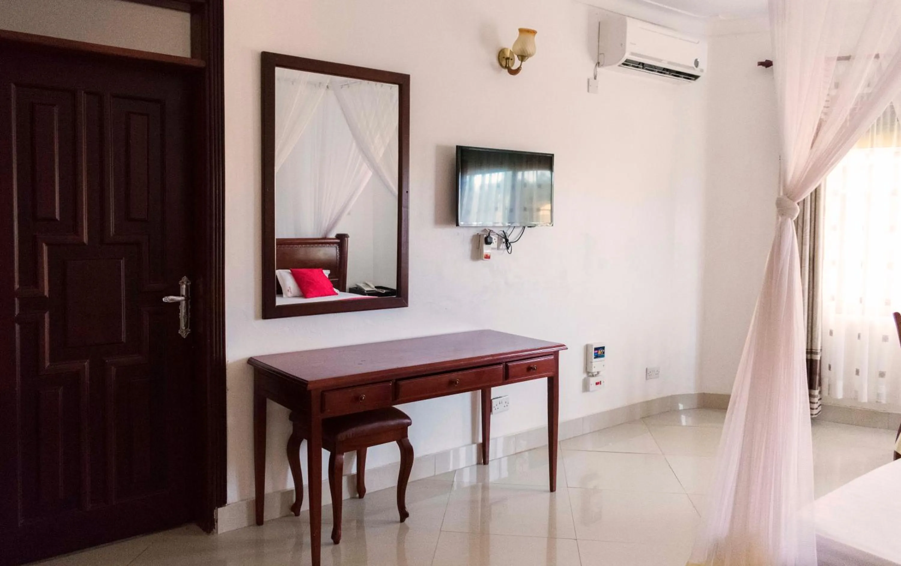 Communal lounge/ TV room in Sienna Beach Hotel Entebbe