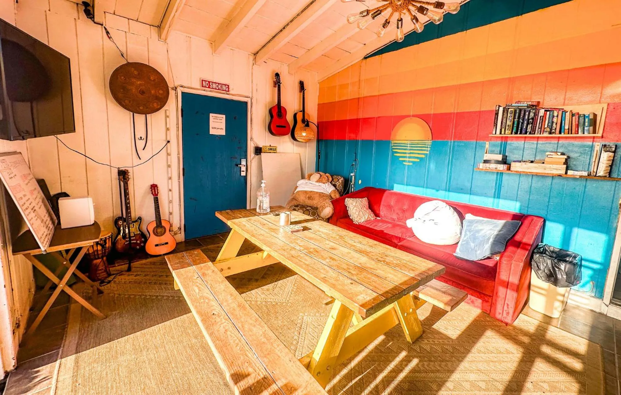 Communal lounge/ TV room in ITH San Diego Beach Bungalow Surf Hostel