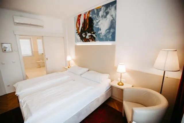 Photo of the whole room, Bed in Boutique Hotel Goldenes Lamm Villach