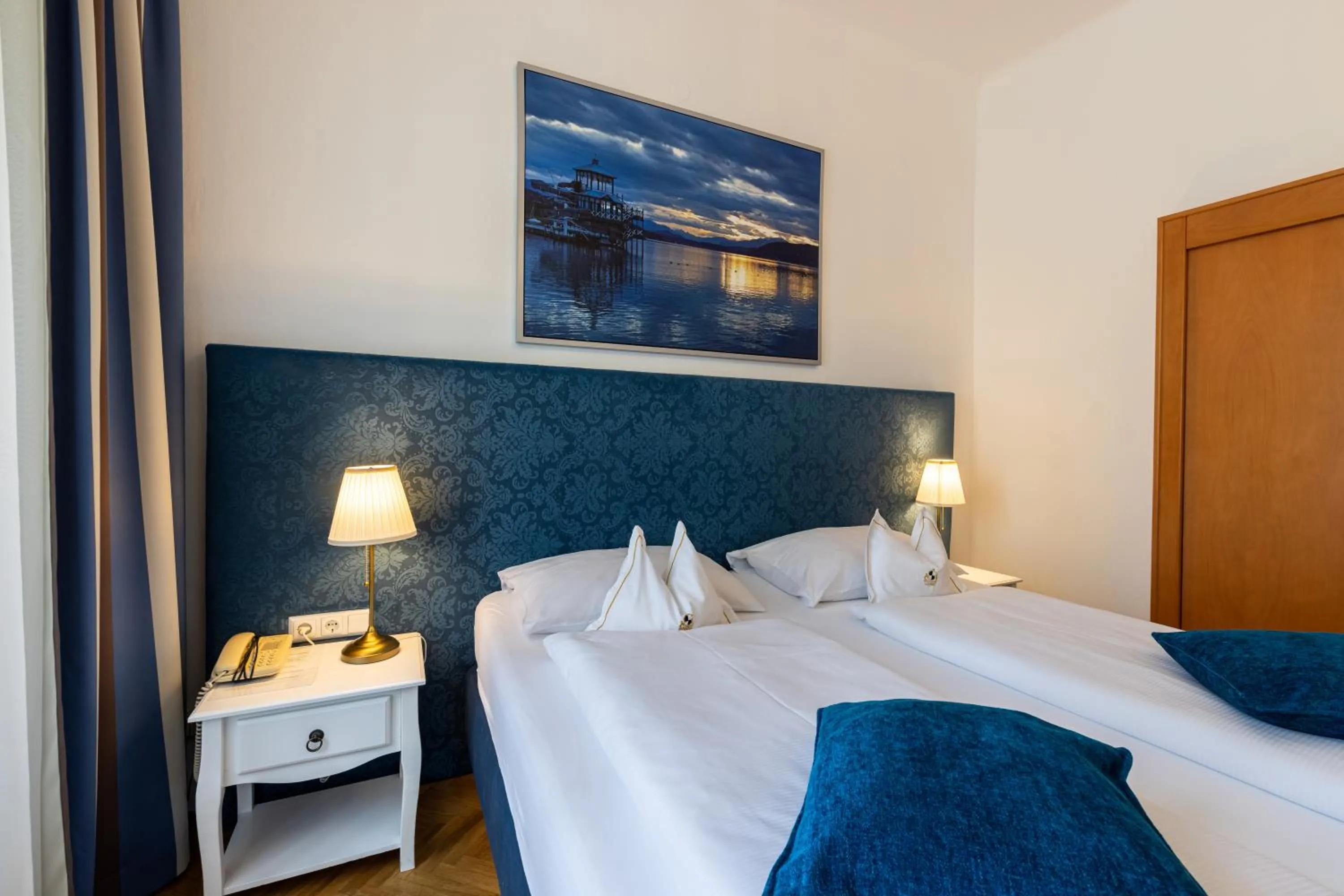 Photo of the whole room, Bed in Boutique Hotel Goldenes Lamm Villach