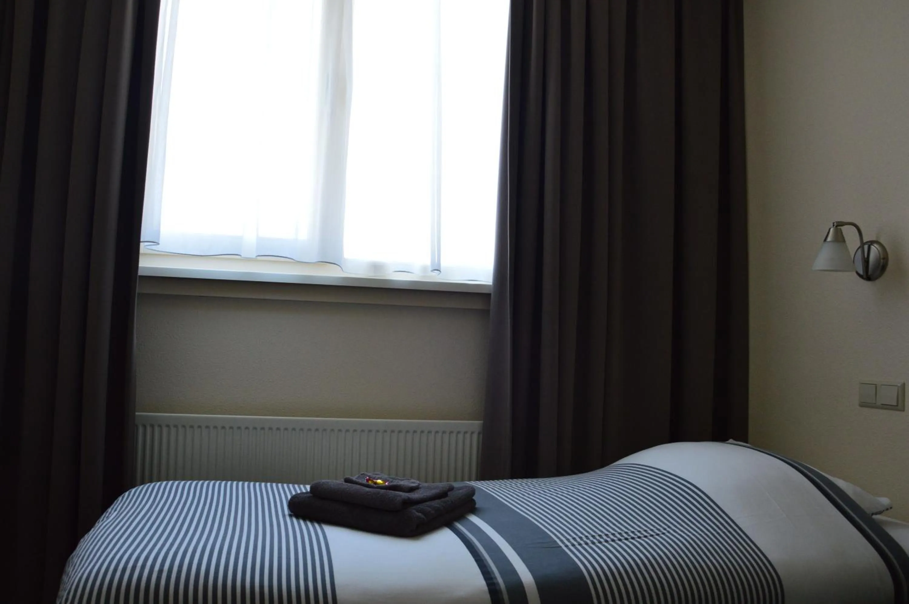 Bed in Hotel Rozenburg