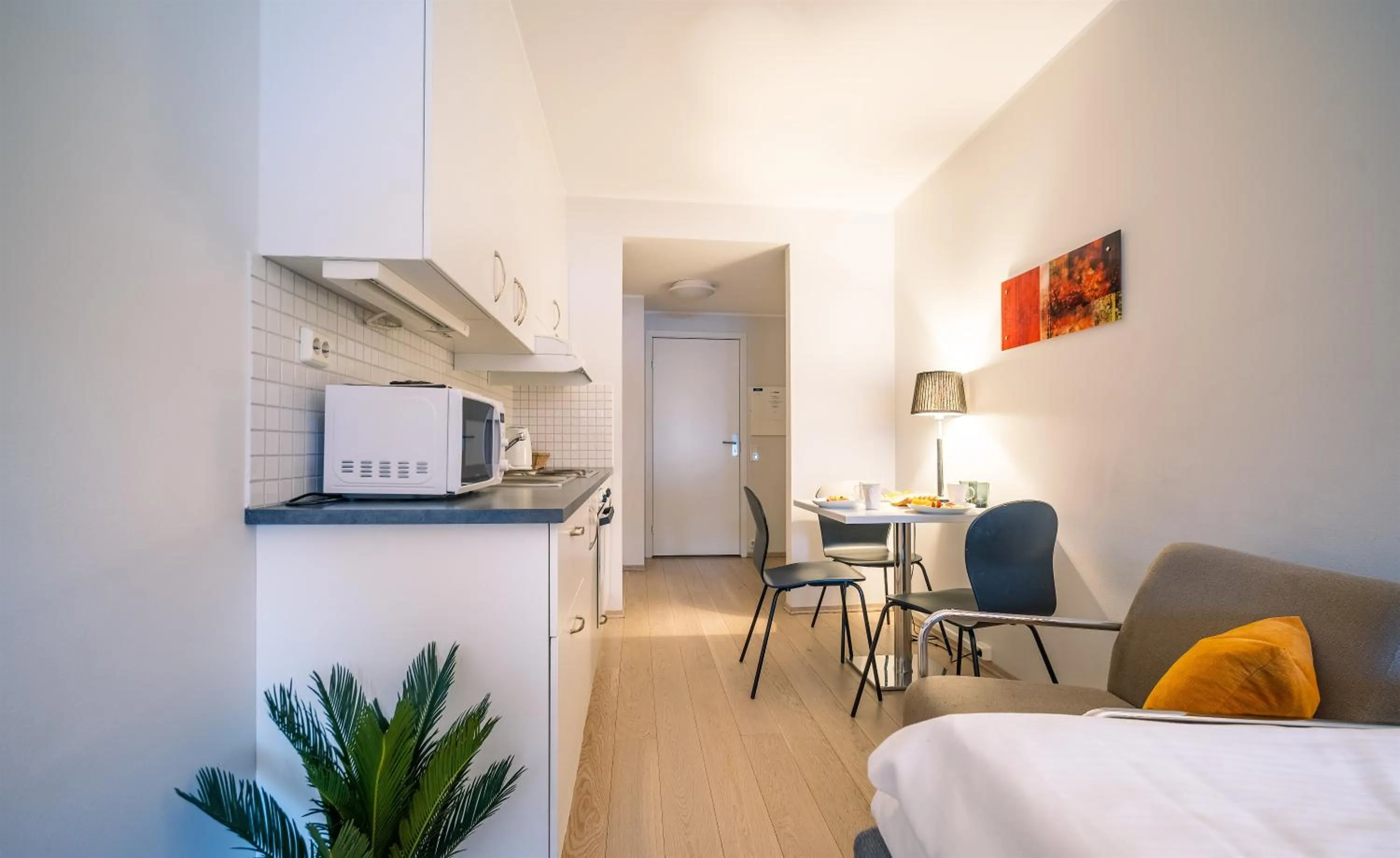 Kitchen or kitchenette, Bed in Enter City Hotel