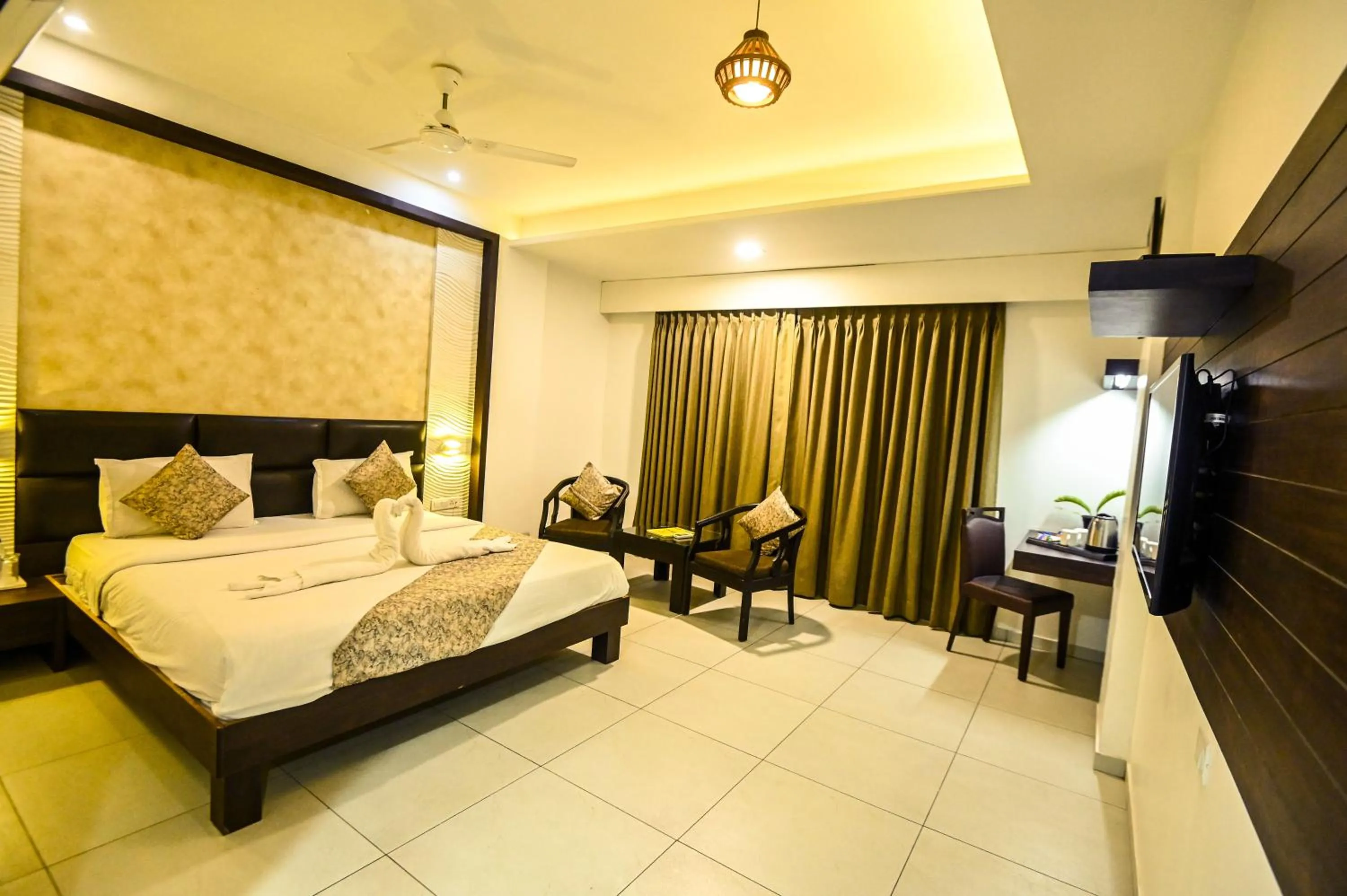 Photo of the whole room, Bed in The Divine Resort Somnath