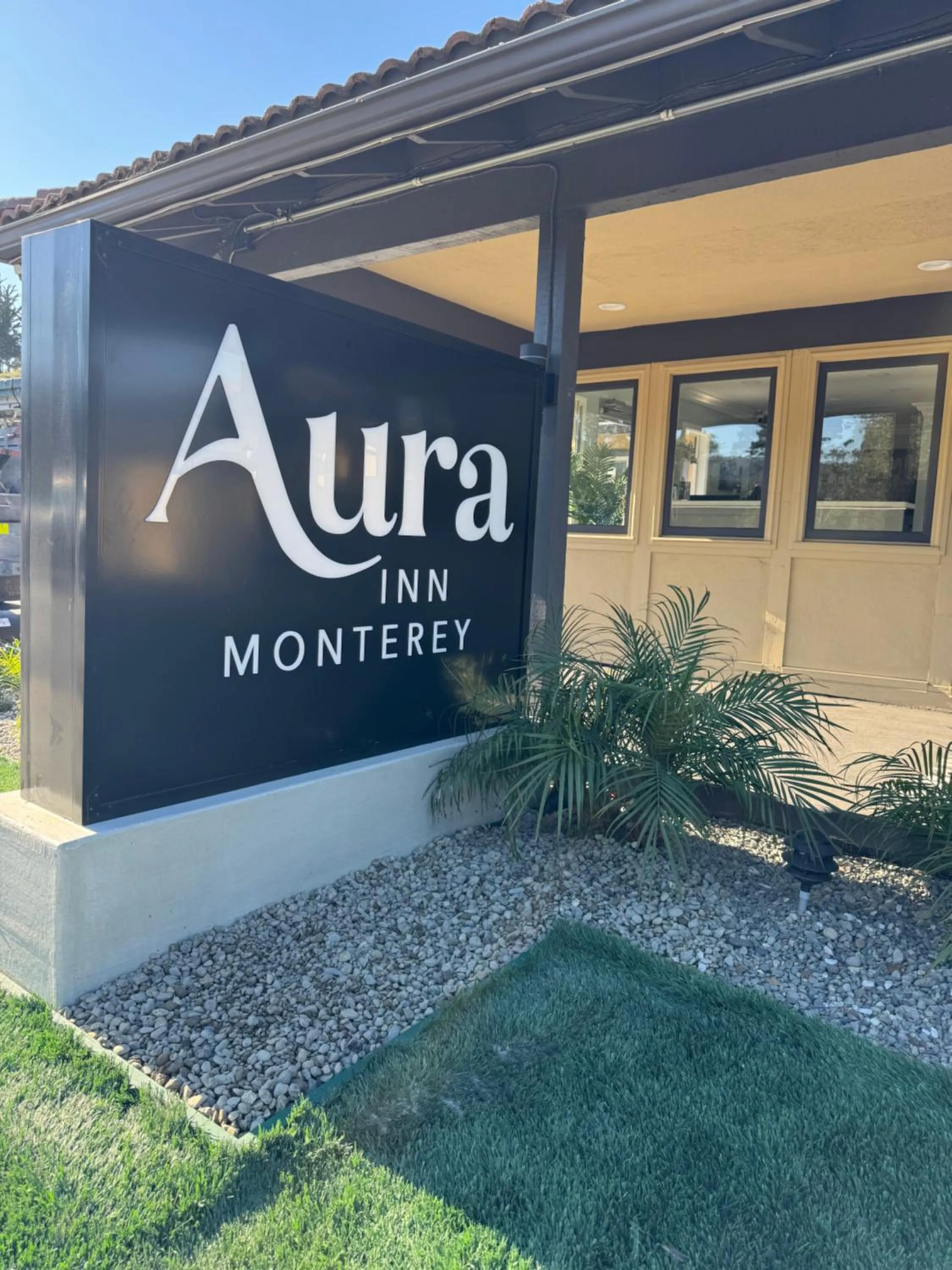 Property logo or sign in Aura Inn Monterey