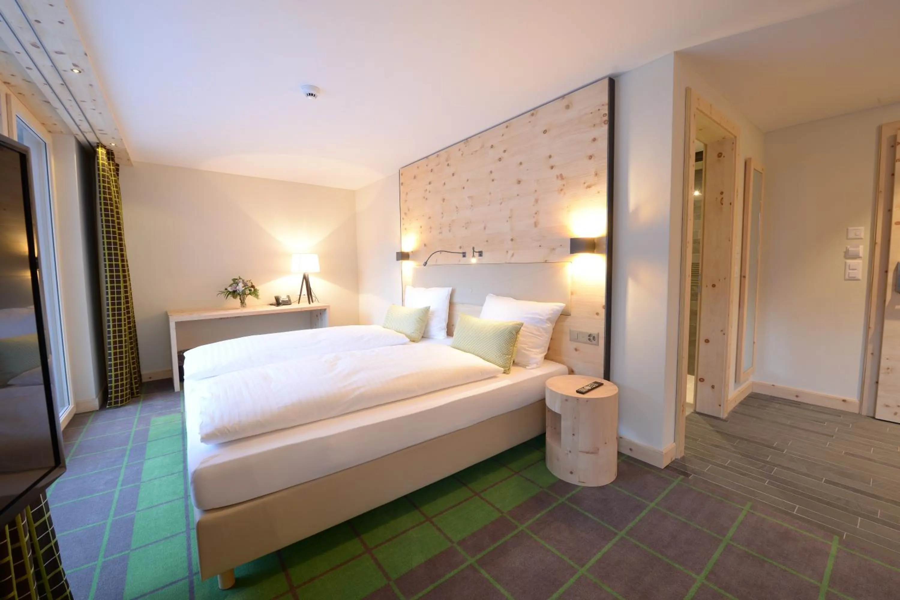 Bed in Alpenhotel Fleurs de Zermatt