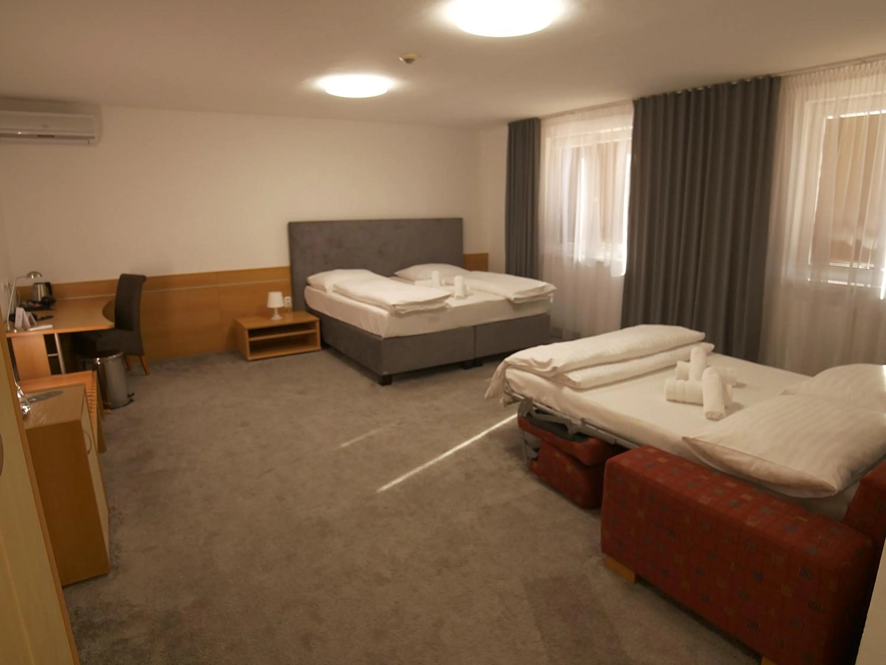 Photo of the whole room, Bed in Hotel Novy Kastiel - Self check-in