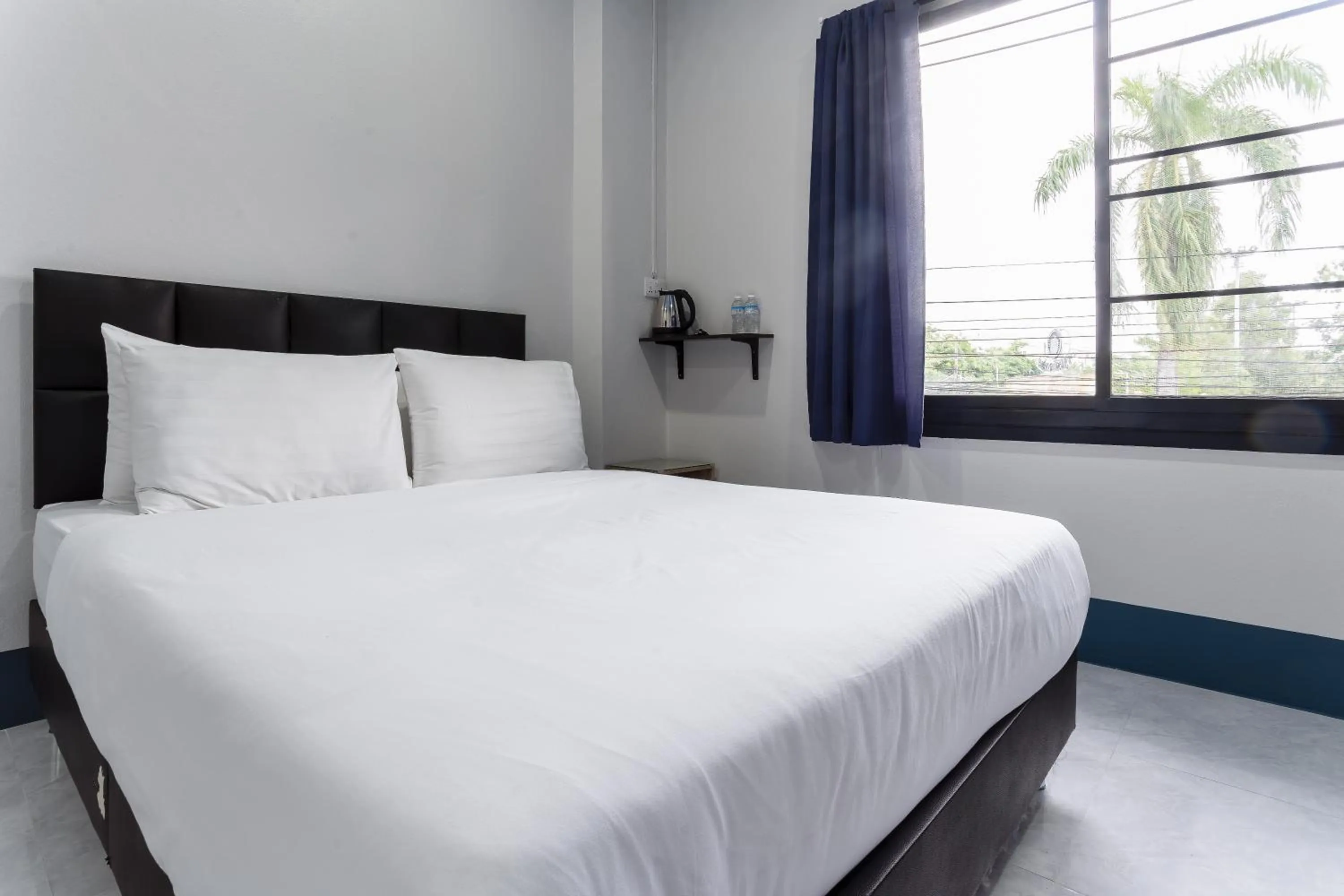 Bed in Udomsuk Hotel