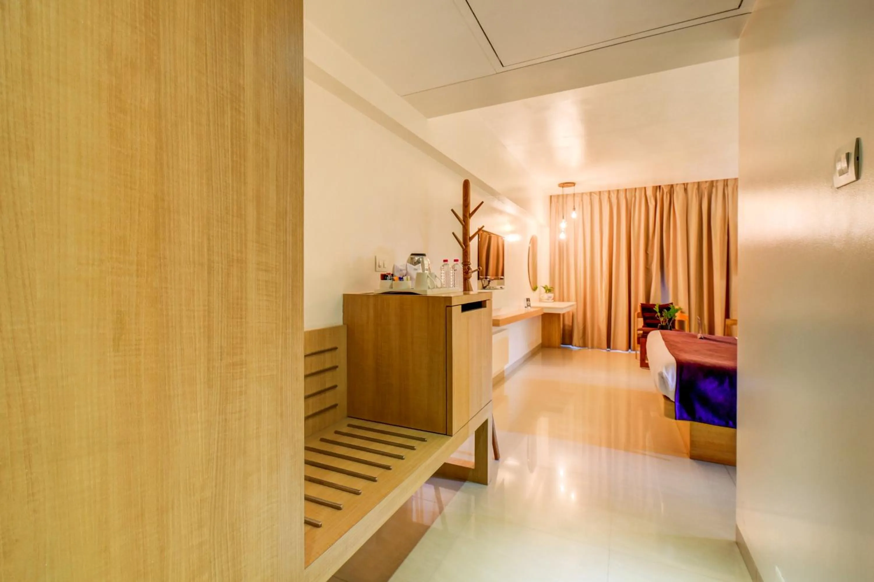 wardrobe, Bed in The SSK Solitaire Hotel & Banquets