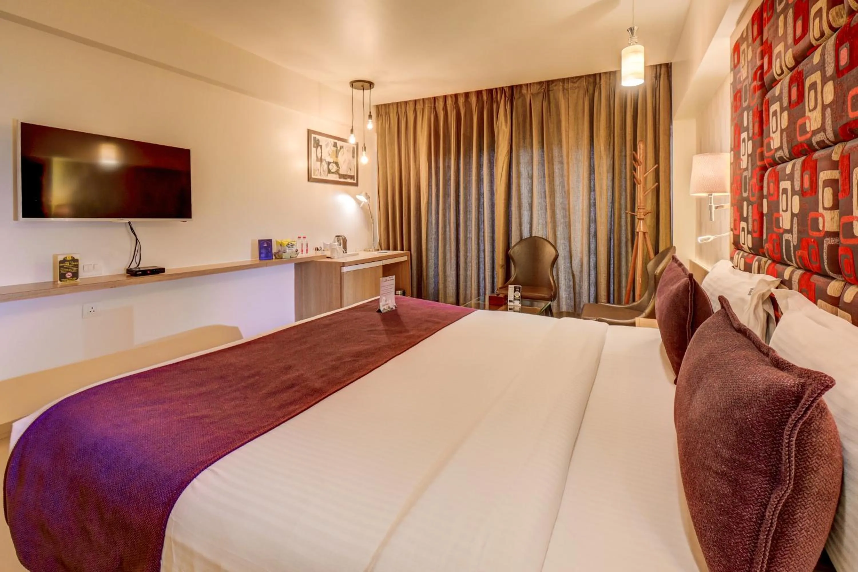 Bedroom, Bed in The SSK Solitaire Hotel & Banquets